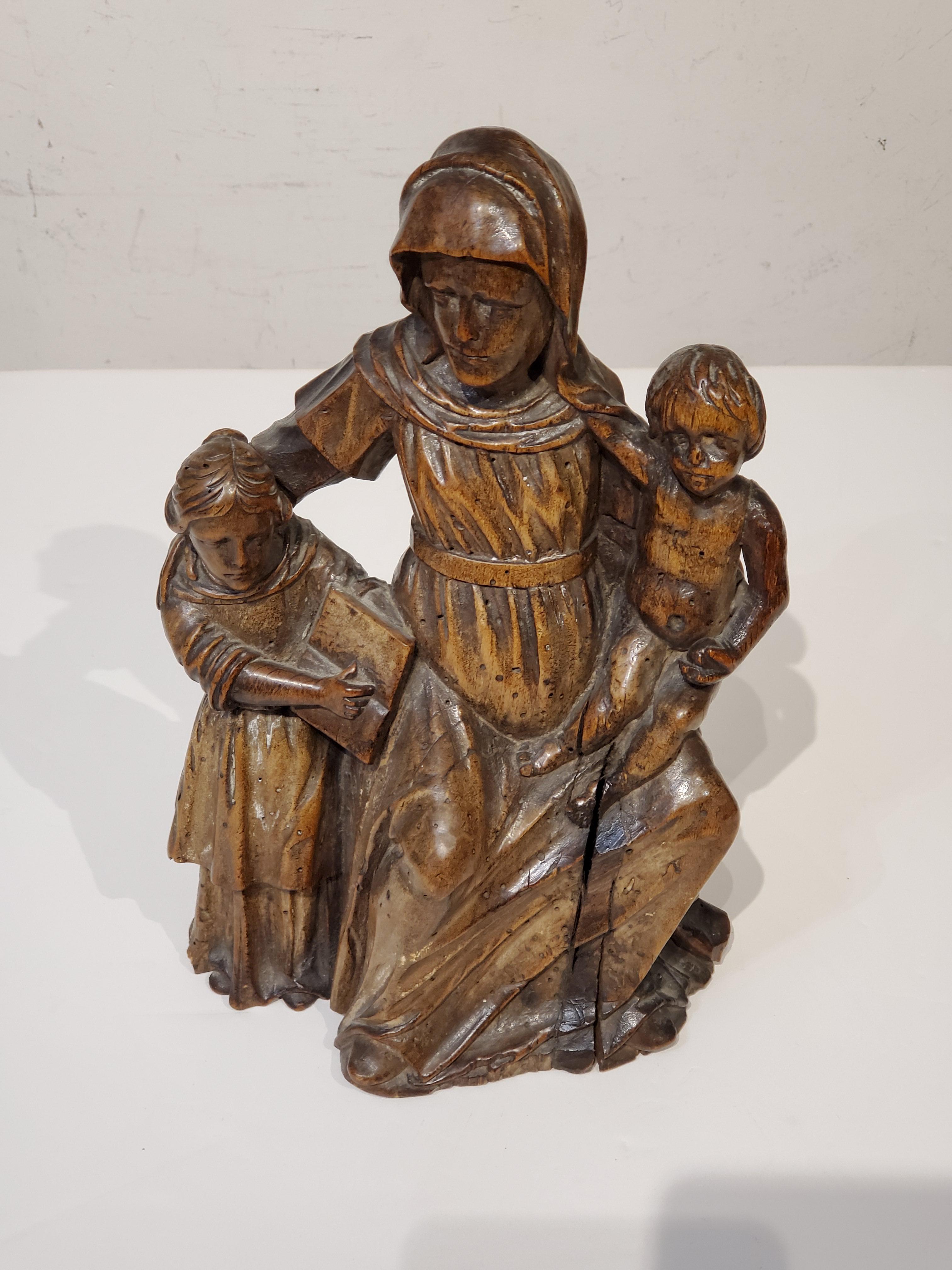 17th Century Italian Carved Wood Carving Of Virgin and Child with Saint Anne - Brown Figurative Sculpture by Unknown