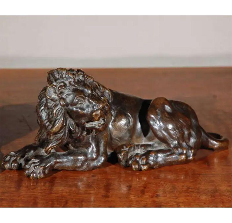 Fabulous pair of French, detailed, hand-cast, recumbent, left and right bronze lions with lush, flowing manes. 