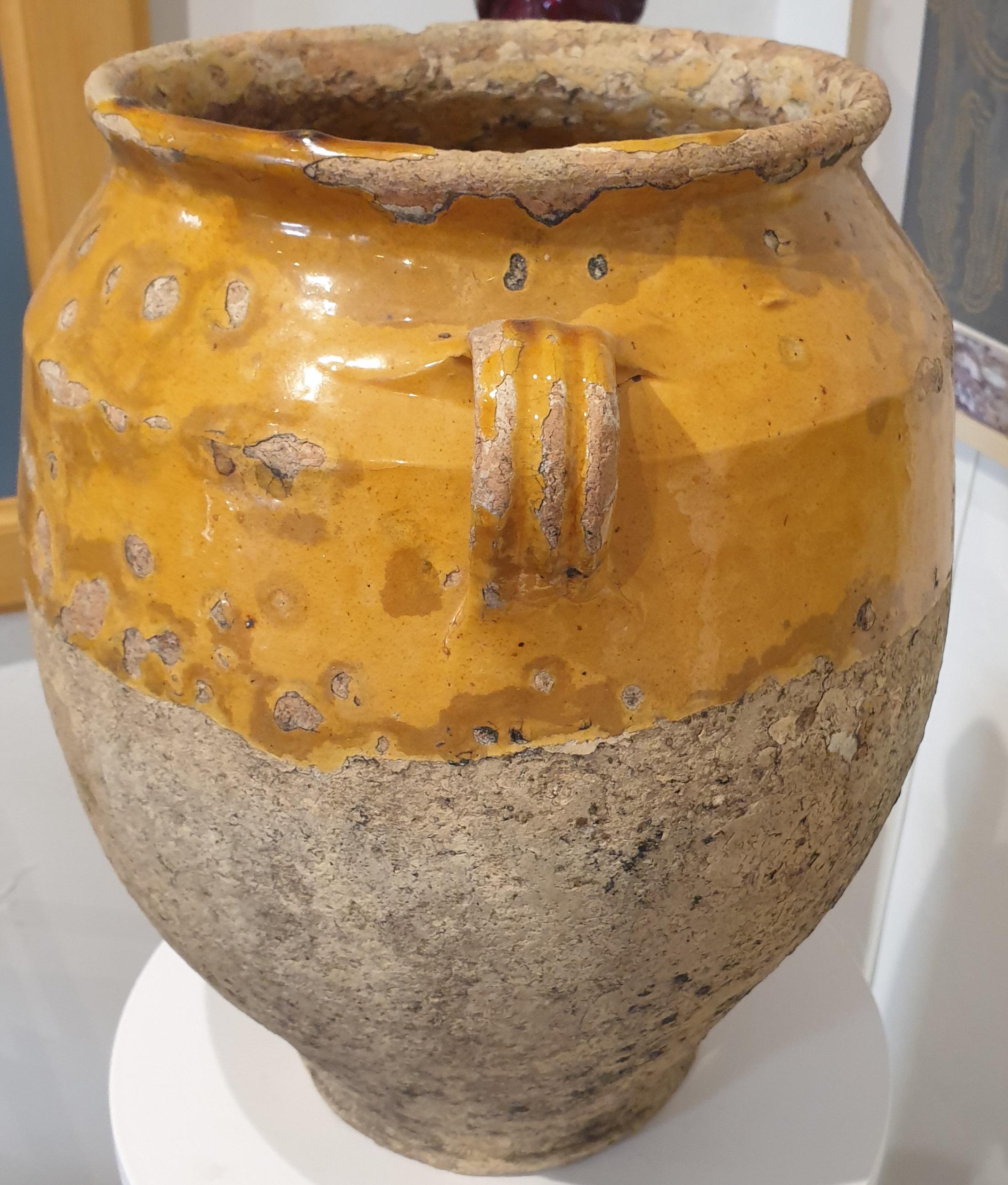 Exceptional good size 19th century French hand made honey glazed terra cotta confit jar from Provence in the south east of France.

Very beautiful patina to both the glaze and the terra cotta, a practical object of yesterday is as beautiful as a