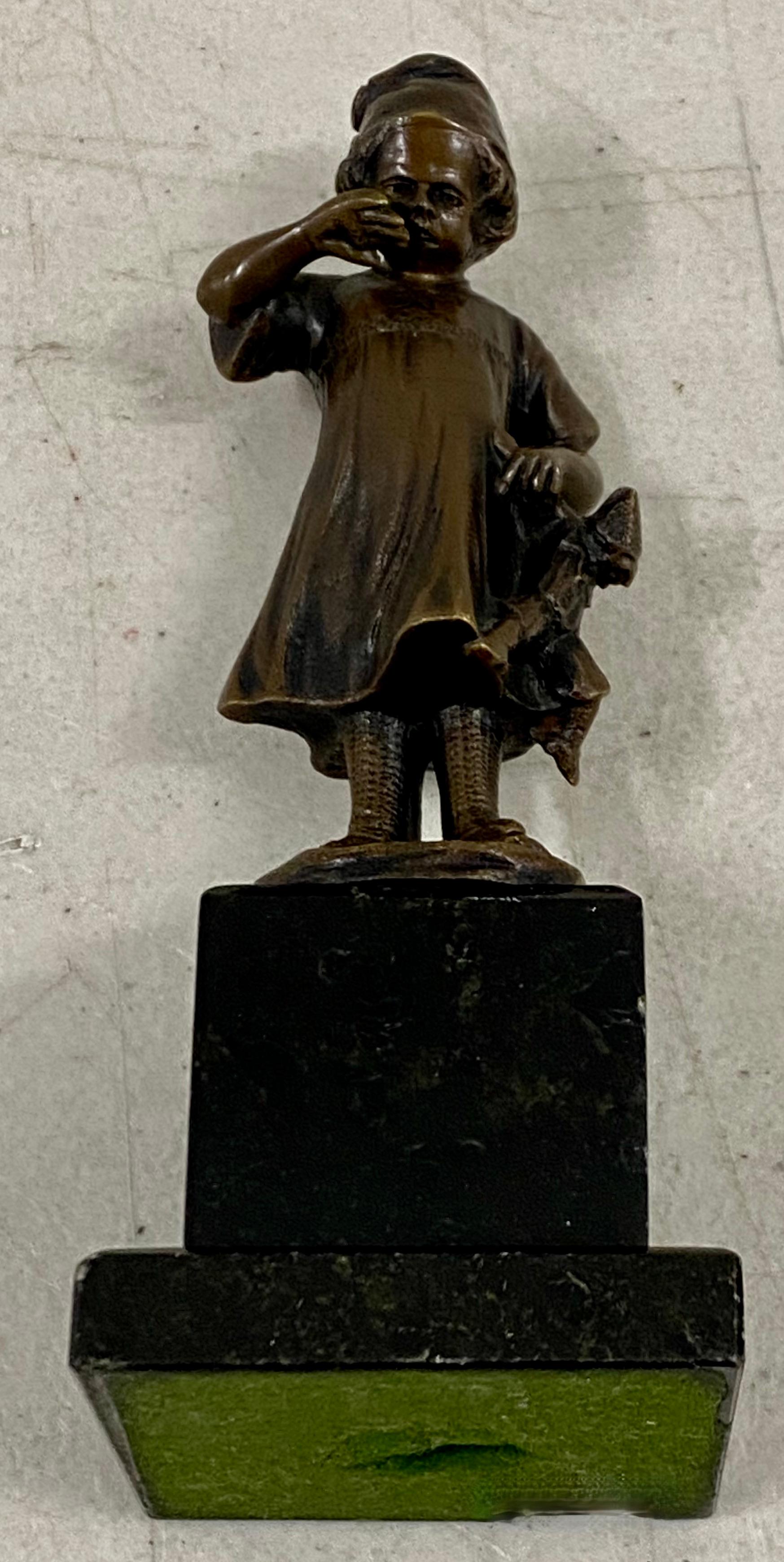 19th Century Miniature Bronze Sculpture of a Young Girl Holding a Doll

Charming bronze atop a marble base

The overall dimensions are 2