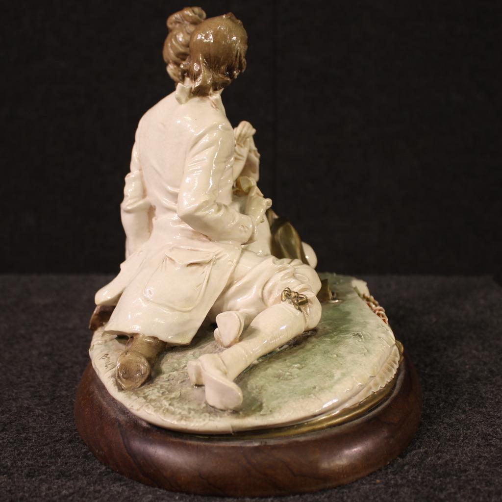 Italian sculpture dated 1981. Capodimonte ceramic artwork signed B. Merli depicting a romantic subject, a couple of lovers. Sculpture signed on the base with a production stamp attributable to the artist Bruno Merli. Ceramic finished for the centre