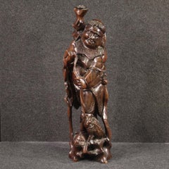 sculpture orientale en bois exotique sculpté du 20e siècle Pêcheur et poisson, 1960