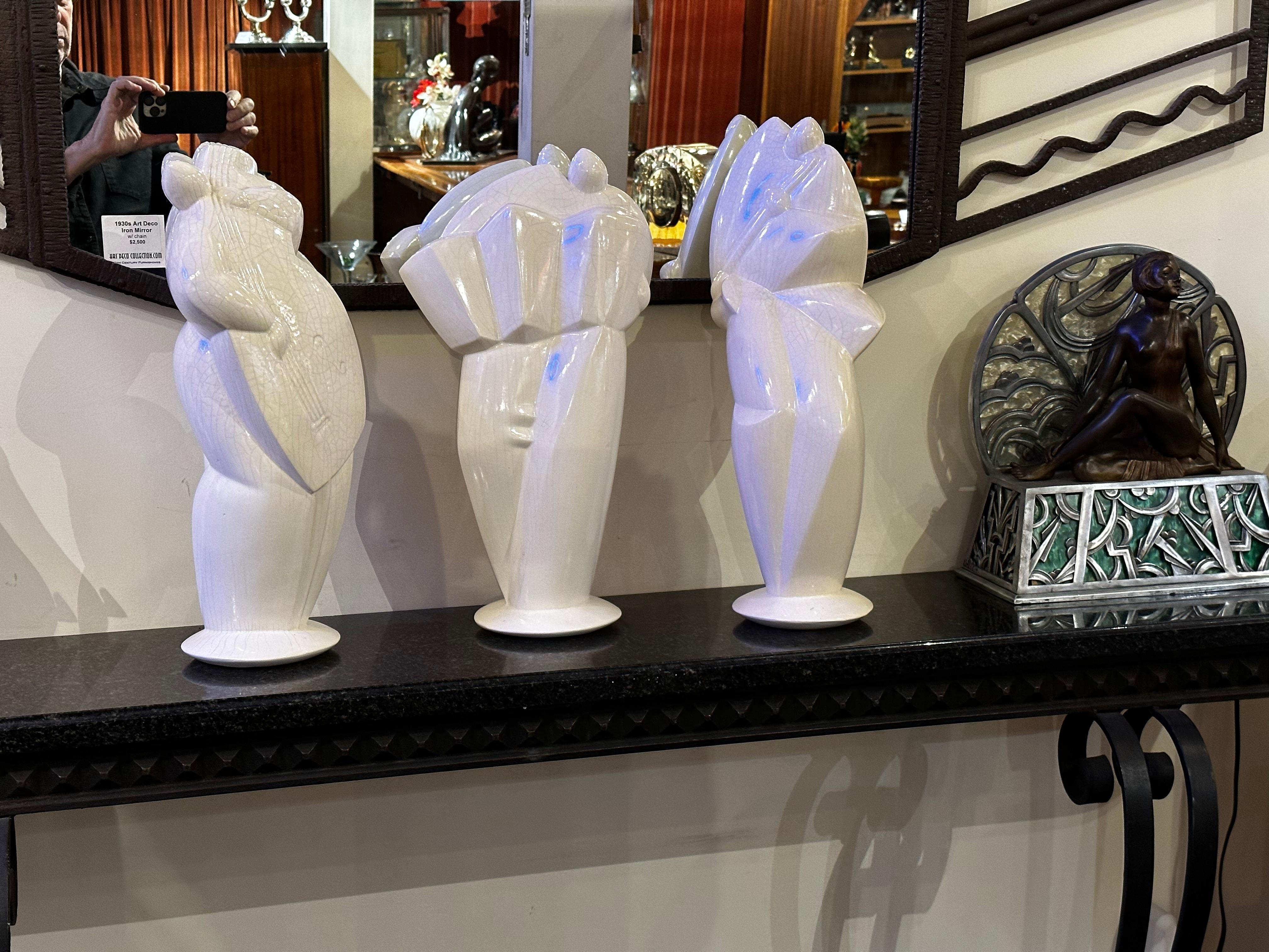 Three Cubist Art Deco style musicians sculptures in ceramic. These large statues are done in a French technique called Craquele (crackle ware). They are signed and numbered “N.R” (Natacha Roche). Groups of ceramic musicians like these are very rare