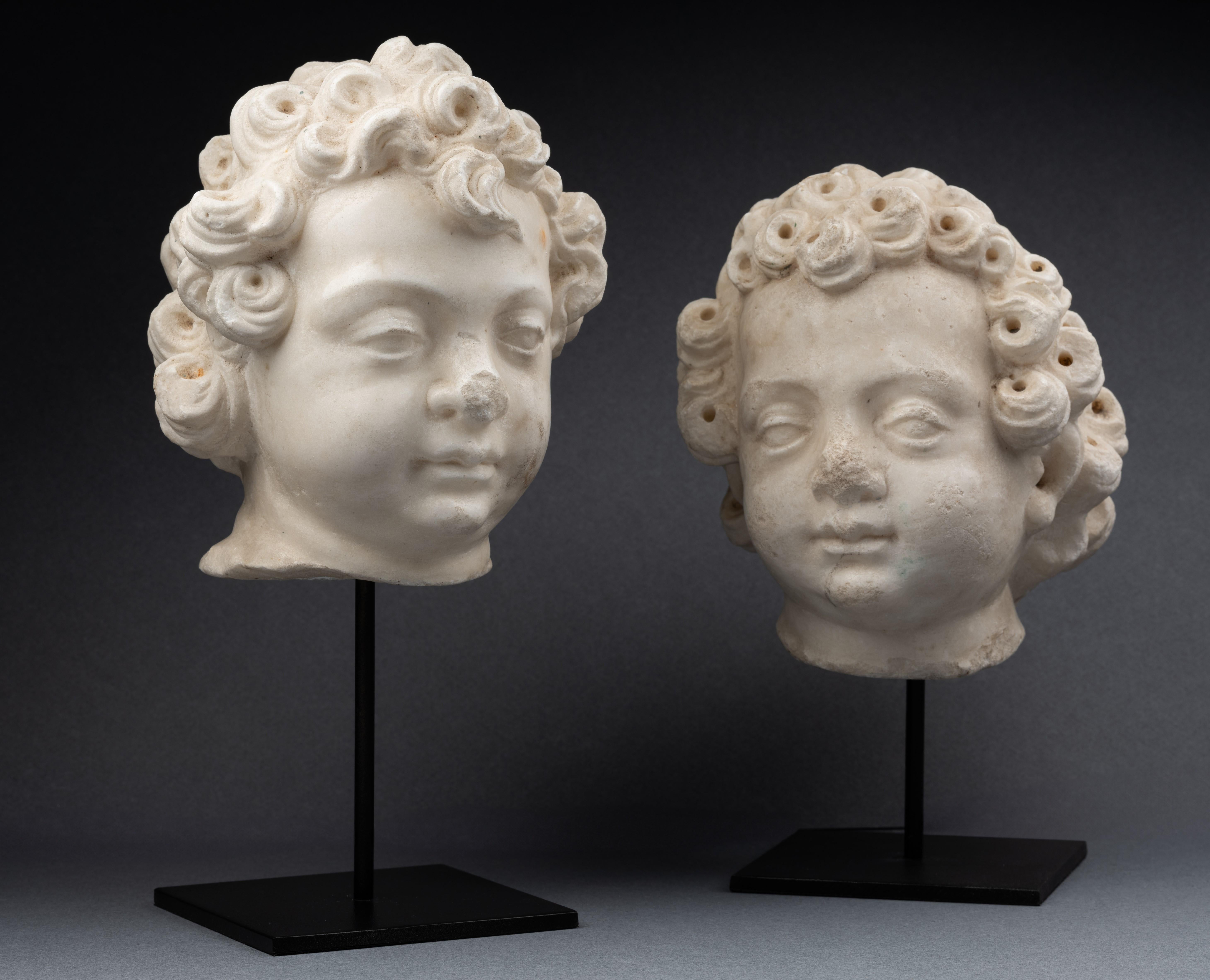 A 16th century Renaissance North Italian marble heads of two puttis - Sculpture by Unknown
