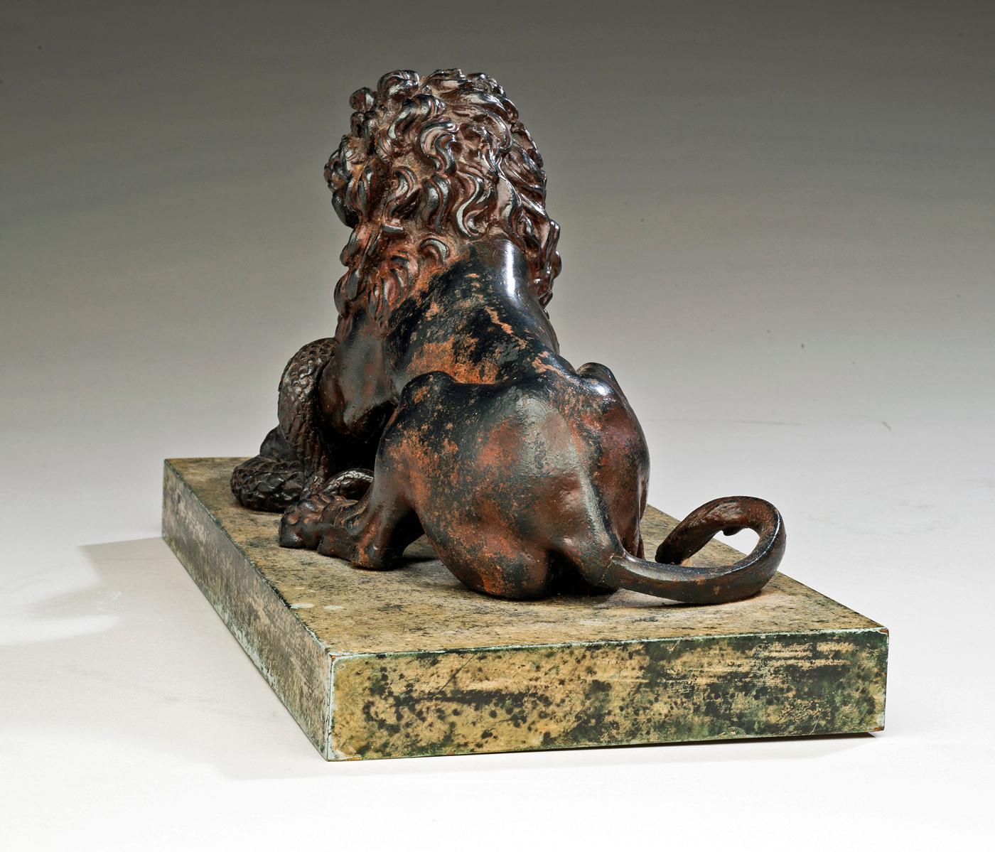 A Cast Iron Lion and Serpent Sculpture After Antoine-Louis Barye. 1