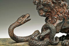 Antique A Cast Iron Lion and Serpent Sculpture After Antoine-Louis Barye.