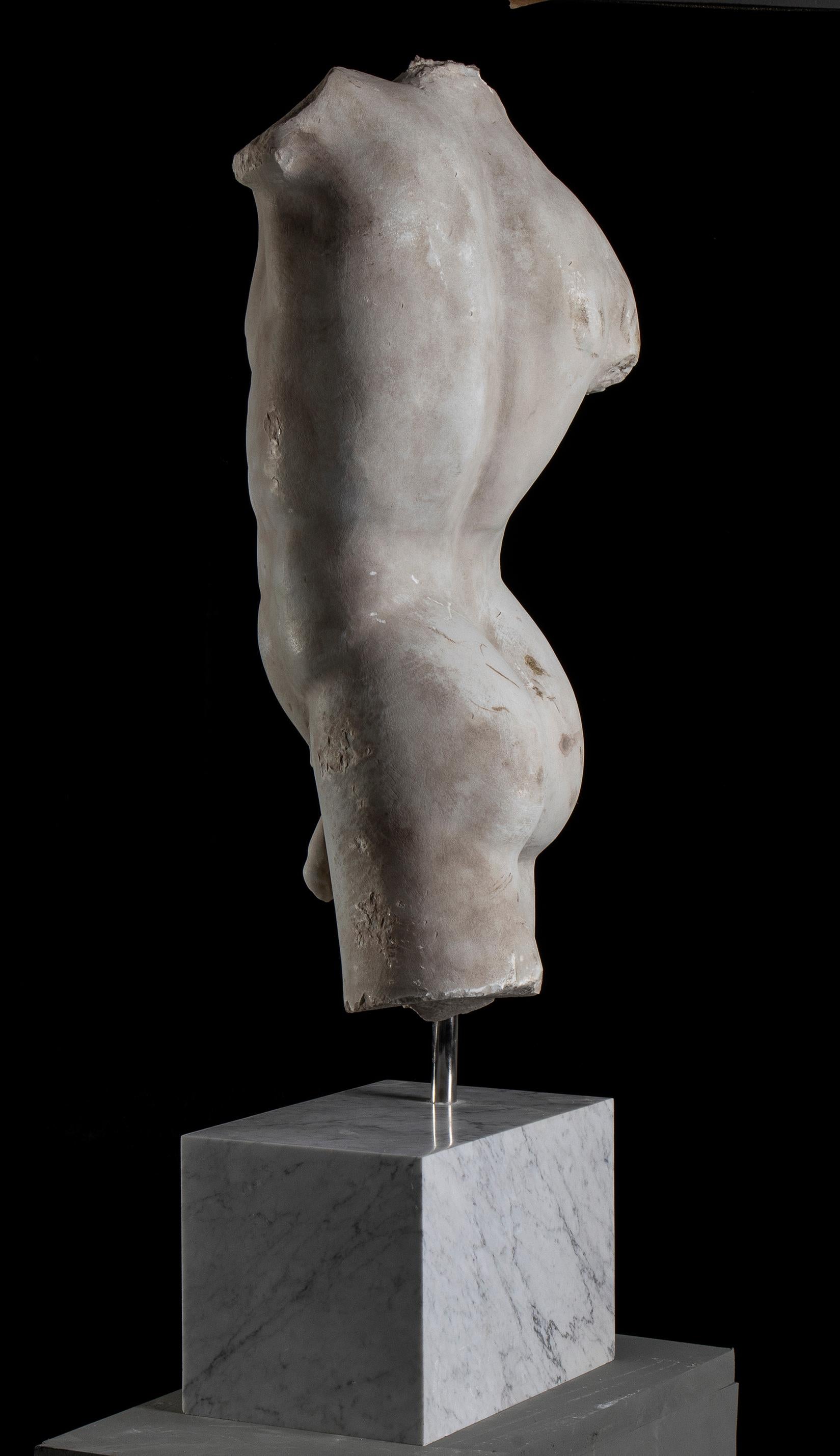 Over-lifesized, the youthful figure depicted nude, standing with his hip thrust to his right, his right arm originally raised, the left lowered and projecting slightly forward, the details of his musculature well defined