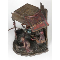 A Cold Painted Austrian bronze Lamp of a Cobbler Shop