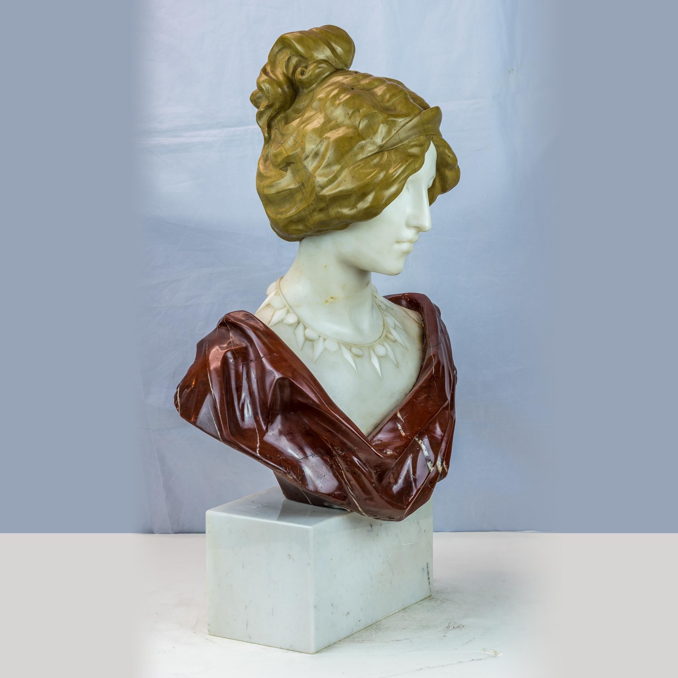 A Fine Colorful French Variegated Marble Bust of a Young Lady

Origin: French
Date: circa 1880
Dimension: H: 25 in. x W: 17 in. x D: 10 in.