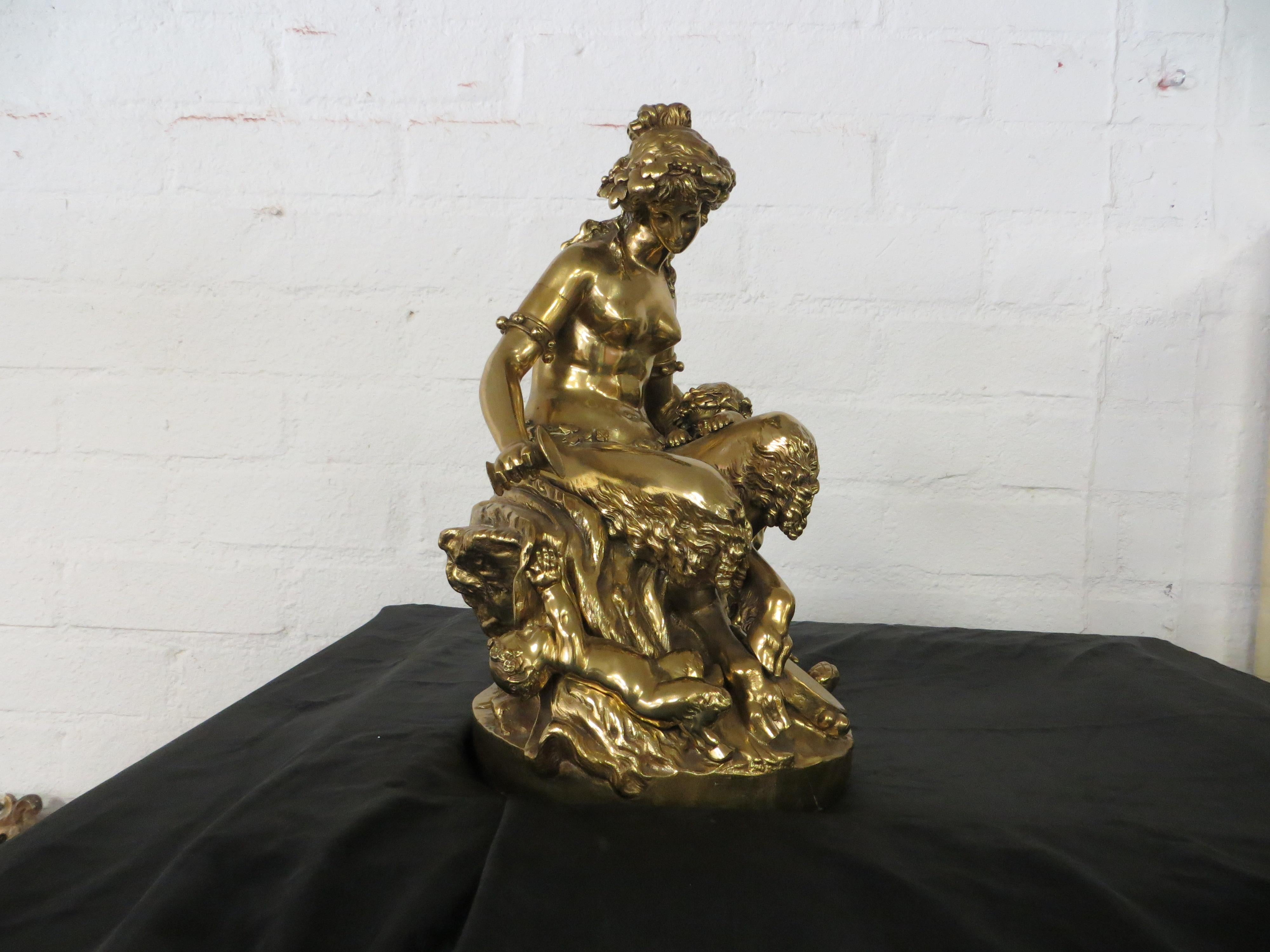 A GOLD PATINATED BRONZE SITTING FAUN - Sculpture by Unknown