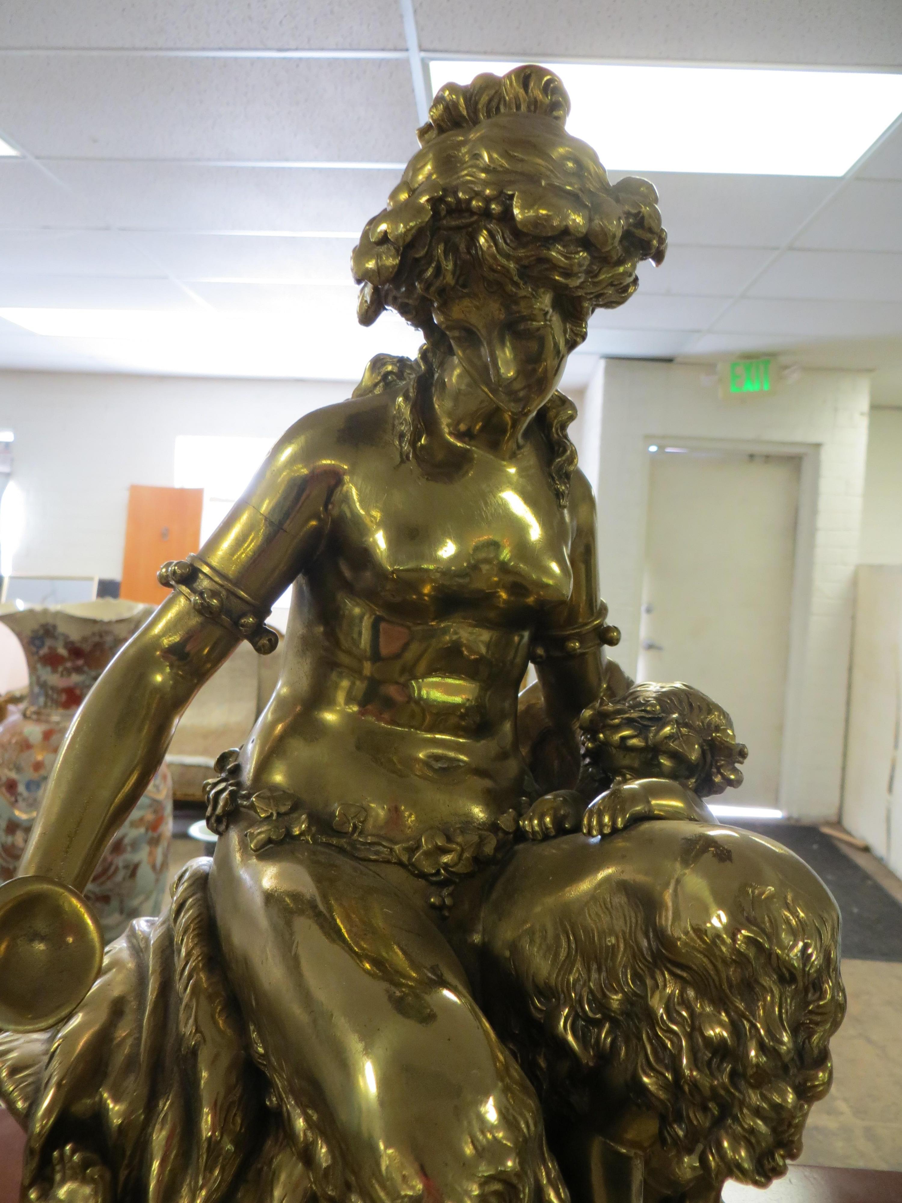  Bronze sculpture, faune in an embrace
A GOLD PATINATED BRONZE SITTING FAUN, 19TH CENTURY 