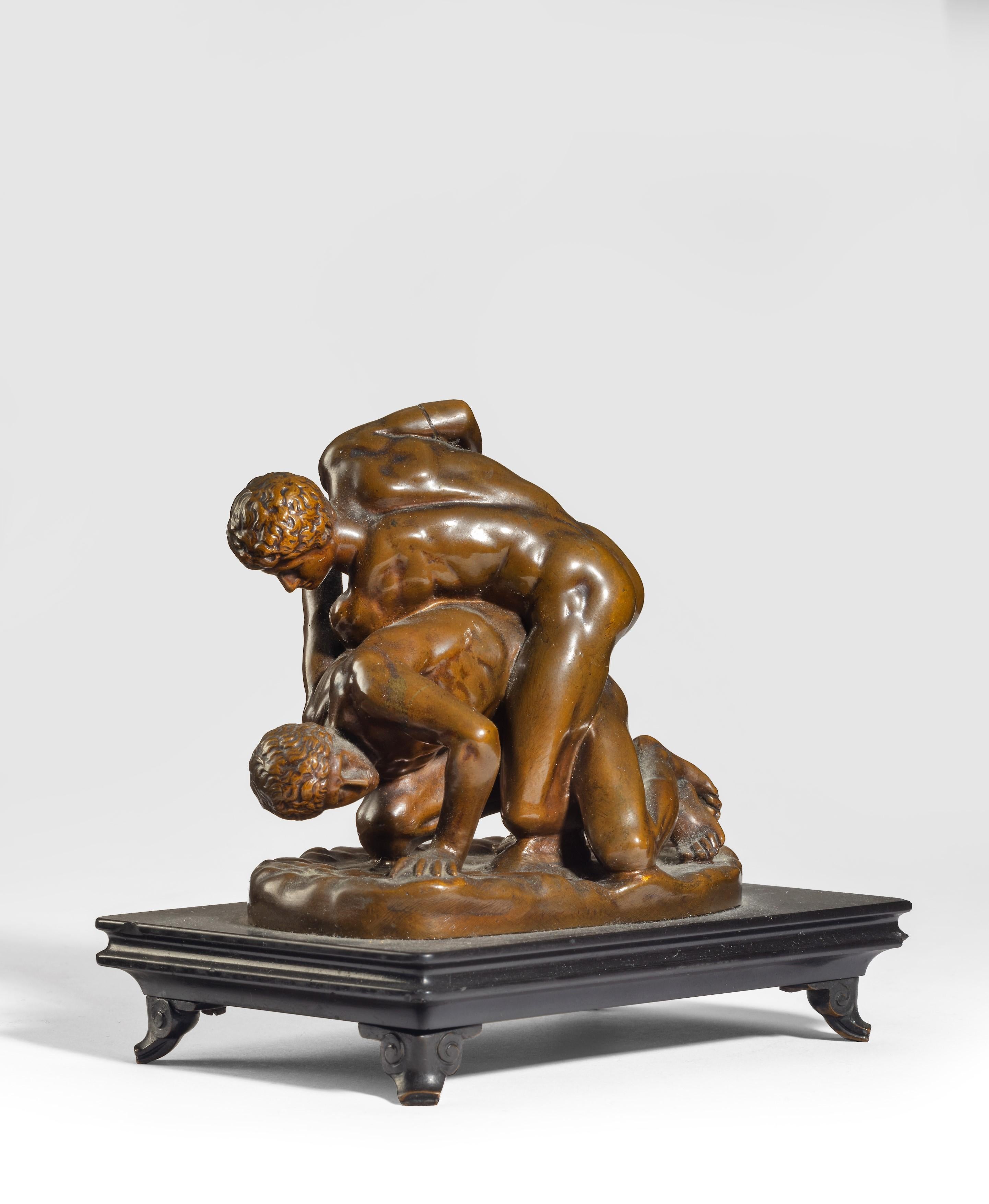 A Grand Tour bronze model of 'The Wrestlers', After the Antique - Gold Figurative Sculpture by Unknown