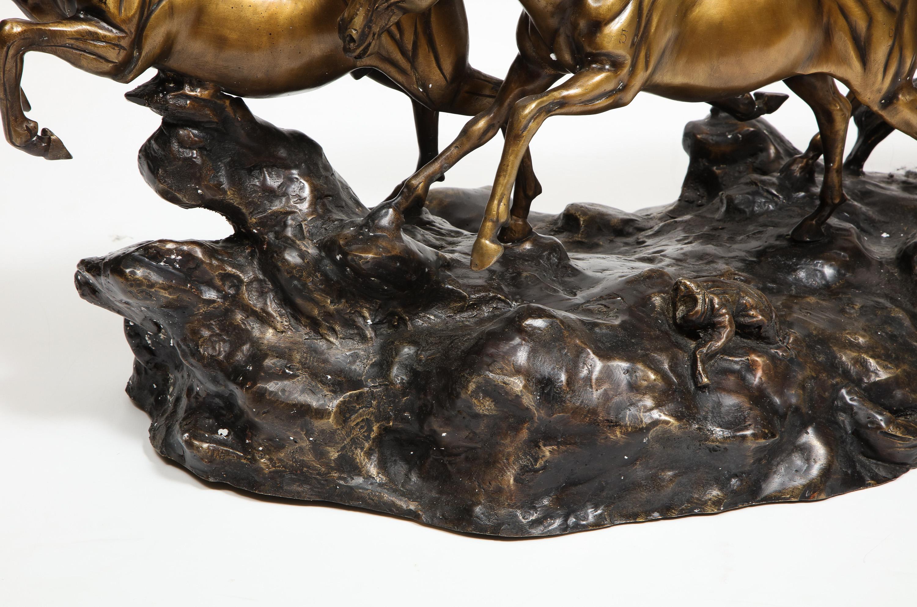 A Massive Patinated Bronze Sculpture of Running Horses 5