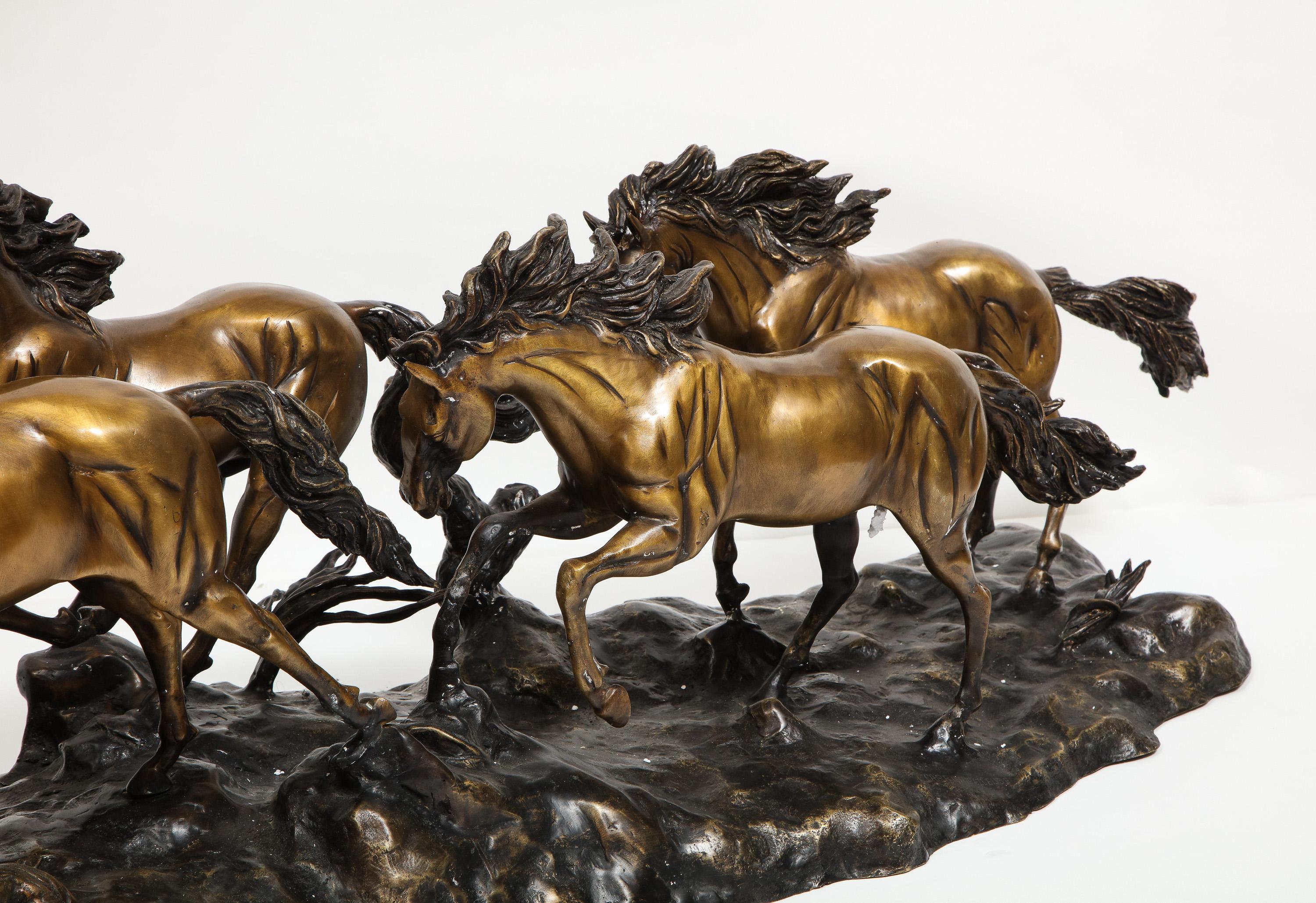 A Massive Patinated Bronze Sculpture of Running Horses 6