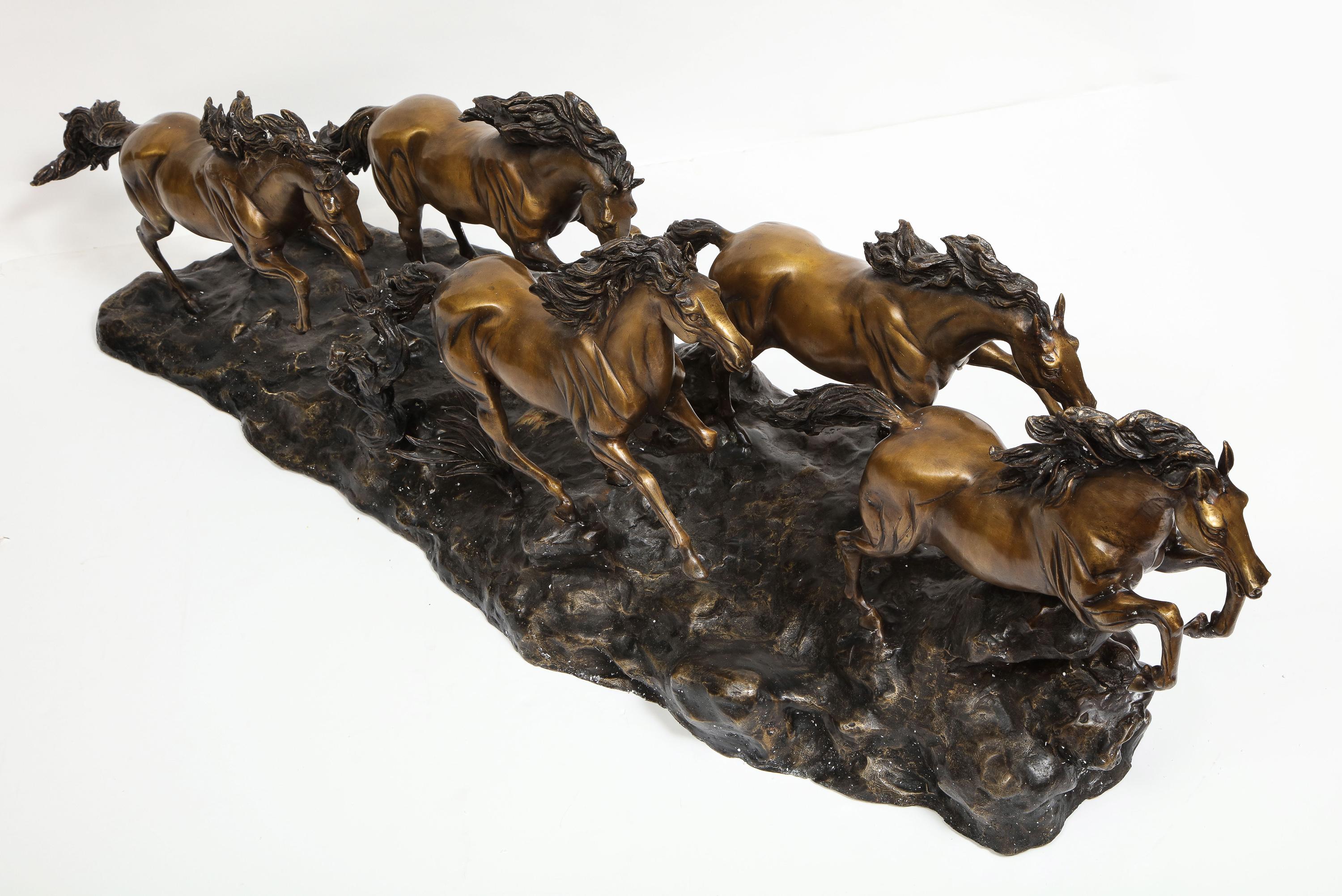 A Massive Patinated Bronze Sculpture of Running Horses 9