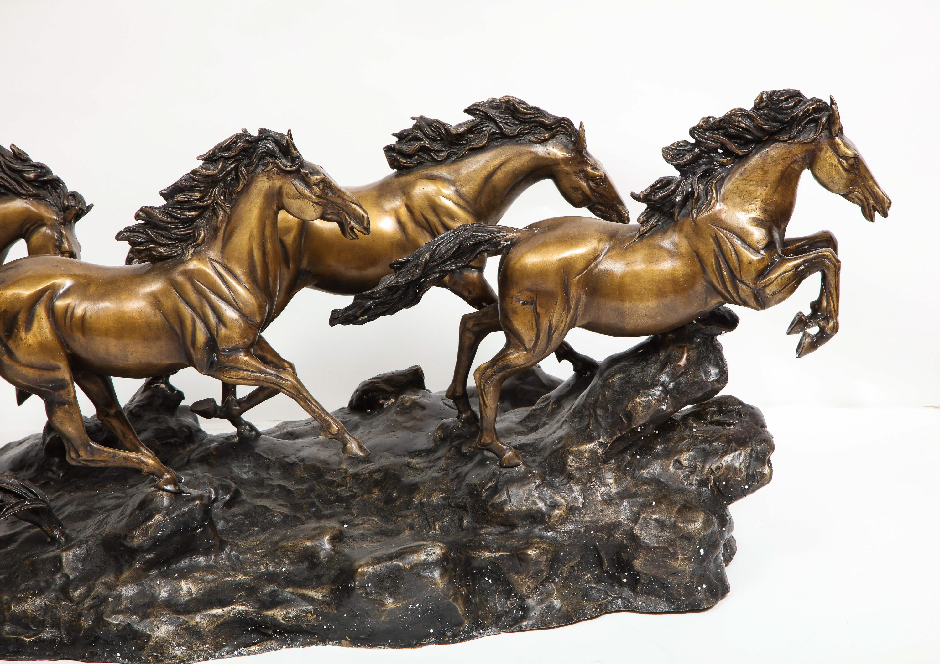 A Massive Patinated Bronze Sculpture of Running Horses 12