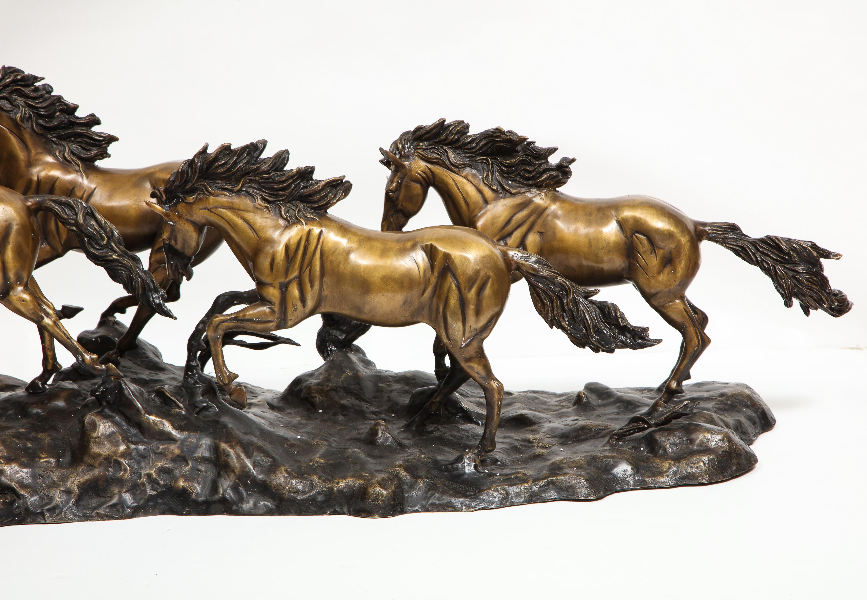 A Massive Patinated Bronze Sculpture of Running Horses - Gold Figurative Sculpture by Unknown