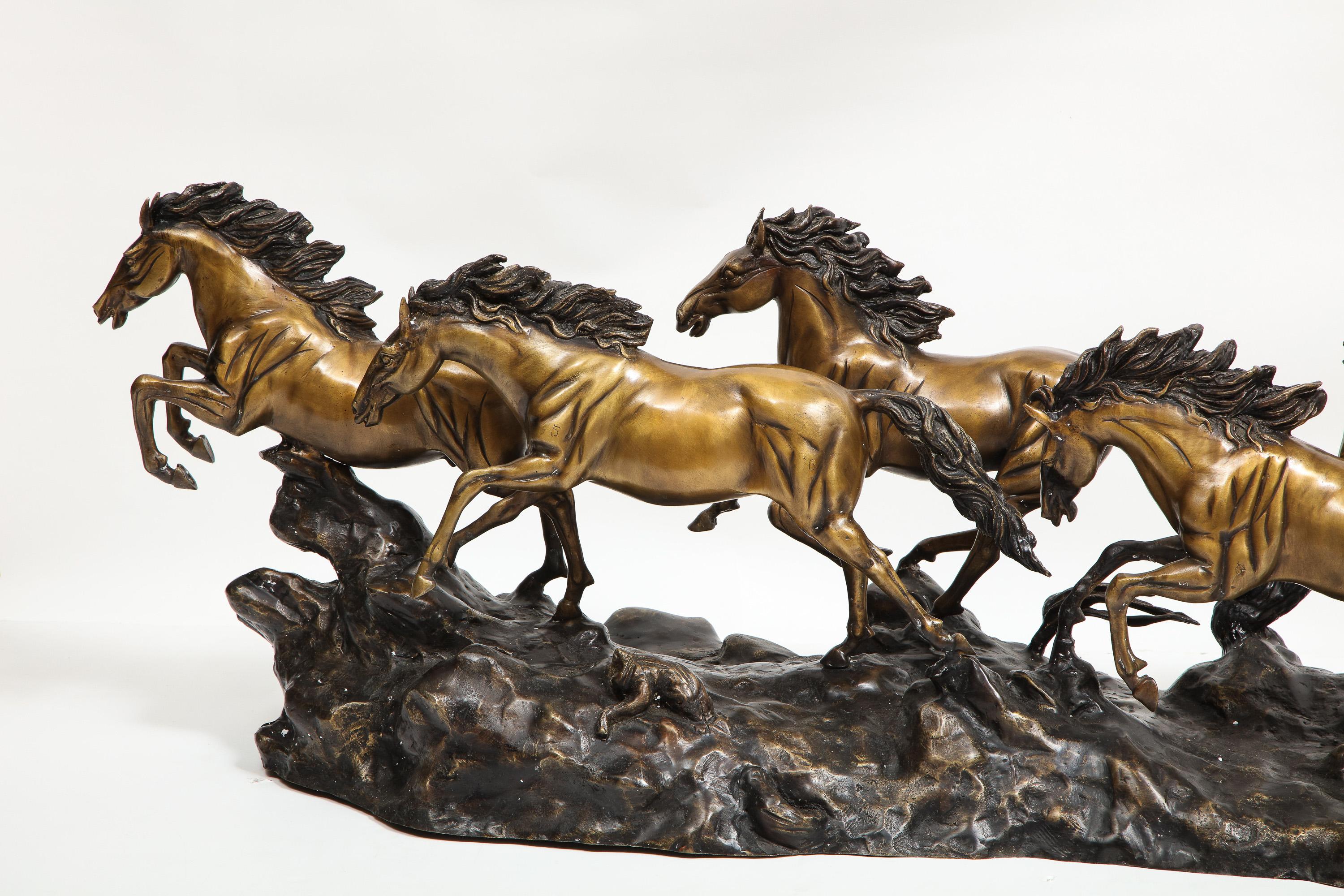 A Massive Patinated Bronze Sculpture of Running Horses, 20th century.

Depicting five running stallion horses all in bronze.

Very good quality, and extremely recommended for horse lovers and collectors alike.

No marks found. In excellent
