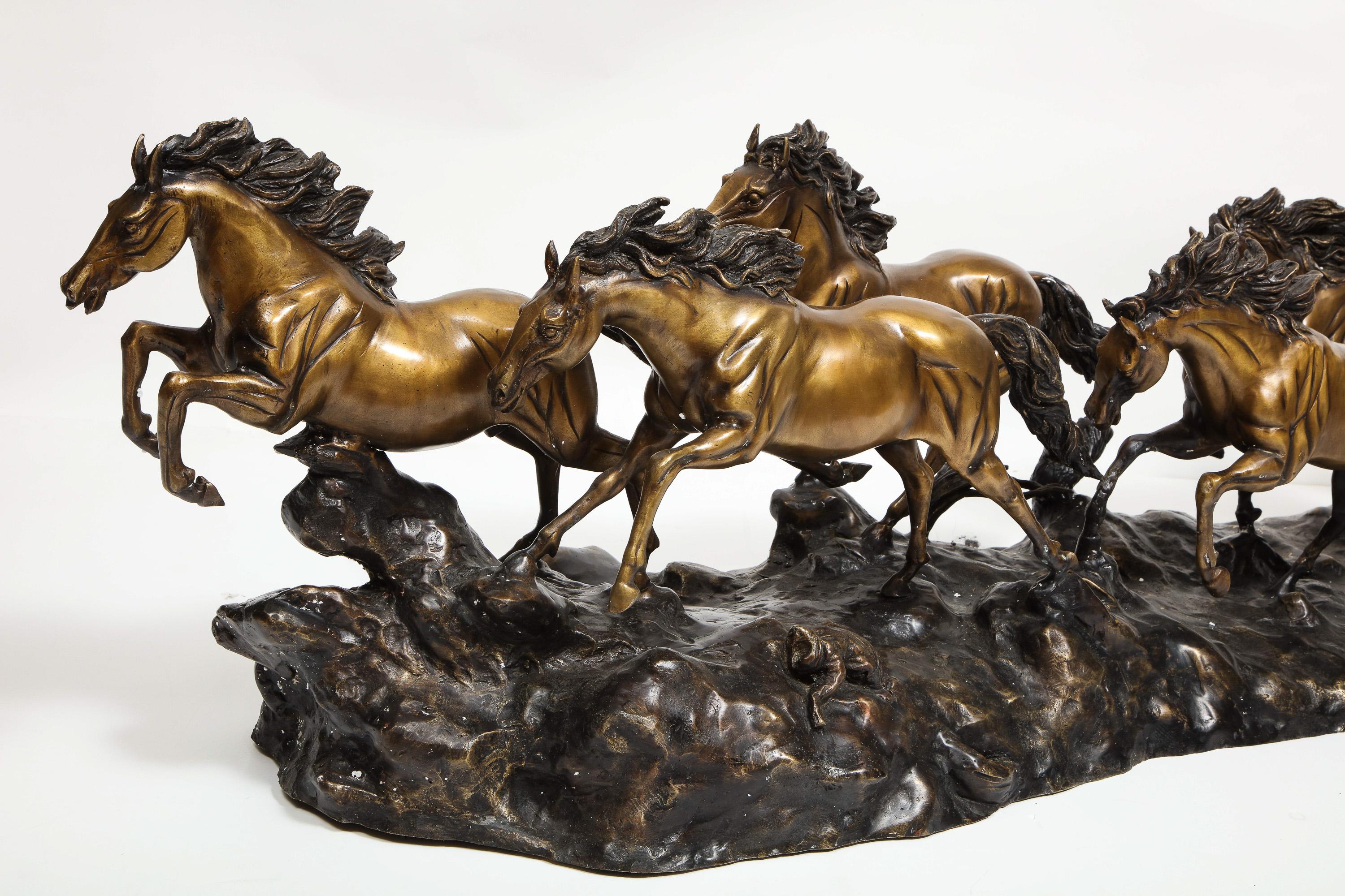 A Massive Patinated Bronze Sculpture of Running Horses 2