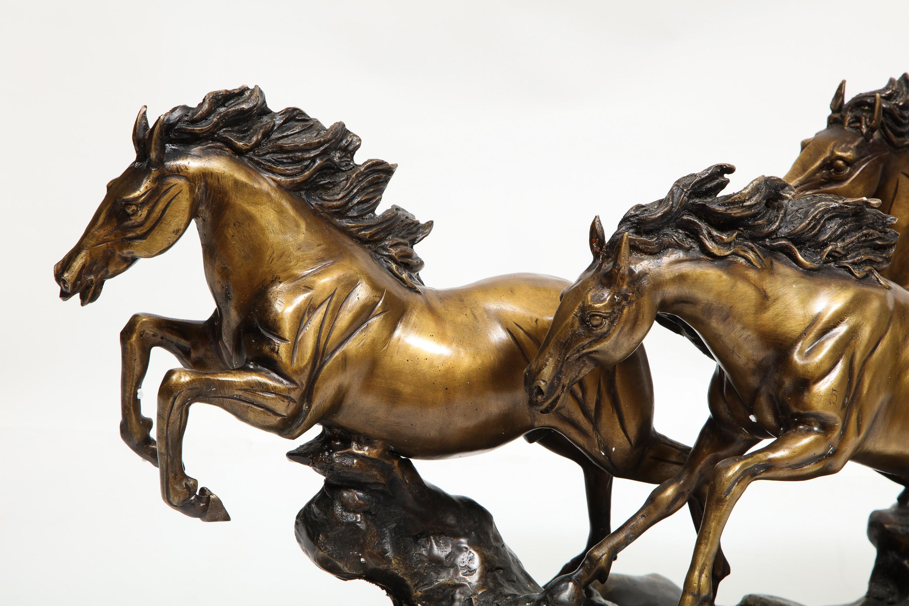 A Massive Patinated Bronze Sculpture of Running Horses 3