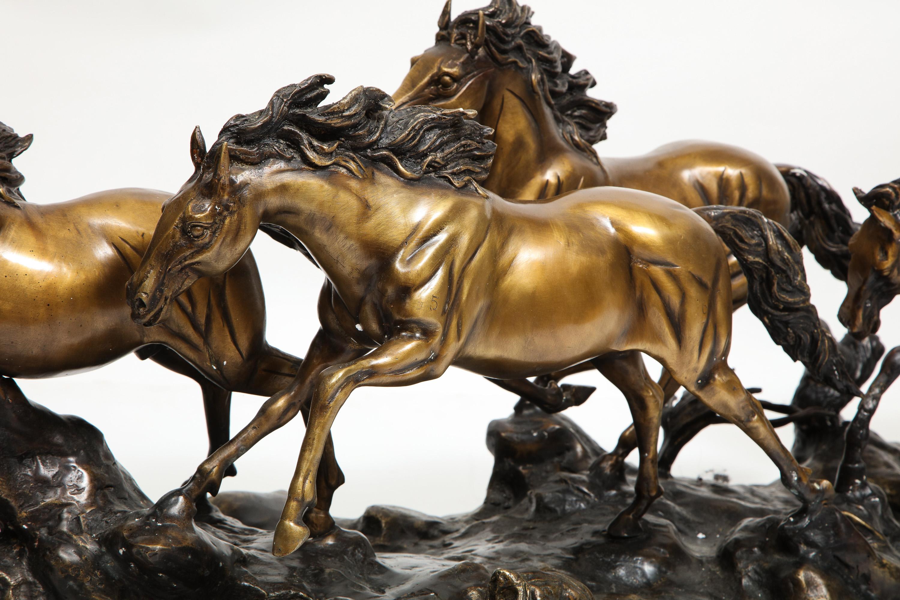 A Massive Patinated Bronze Sculpture of Running Horses 4