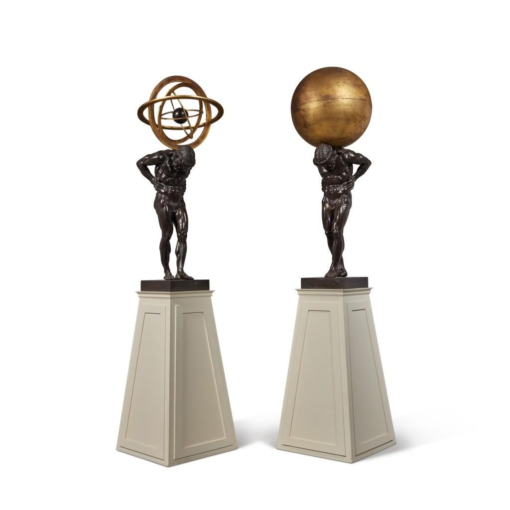 Unknown Figurative Sculpture - A Monumental Pair of Gilt and Patinated Bronze Atlas Figures Sculptures