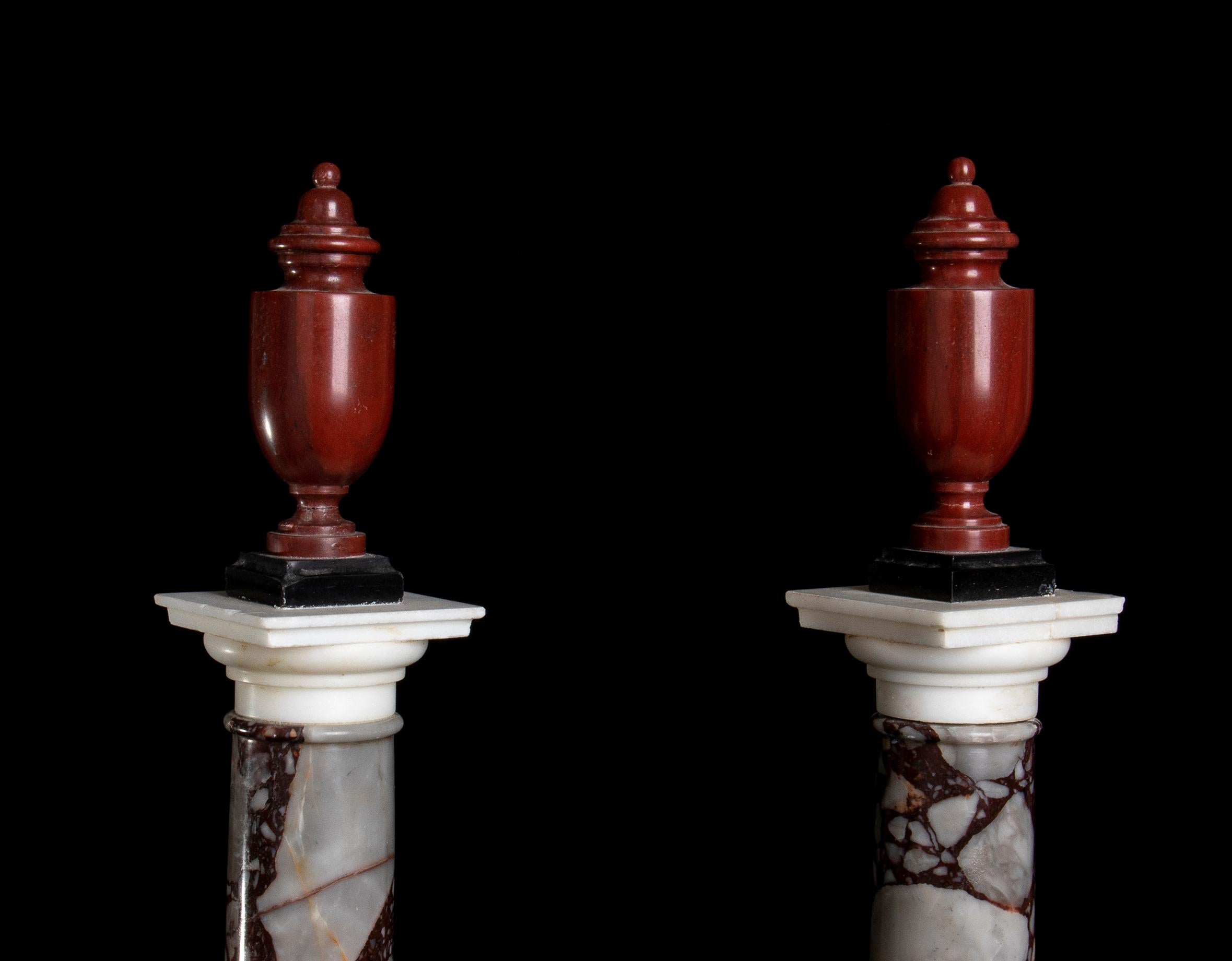 A Pair Of Italian Breccia White and Marble Columns Each Surmounted by an Amphora, a pair of Gran Tour pieces for connoisseurs made with a selection of specimen and rare marble. The Shaft in marble Chio o Portasanta
latin name: Marmor Chium, standing