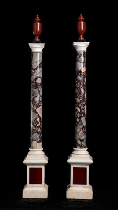 A Pair Of Italian Breccia White and Marble Columns Each Surmounted by an Amphora