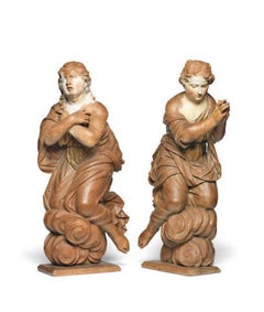 A pair of late 17th century German carved oak angels