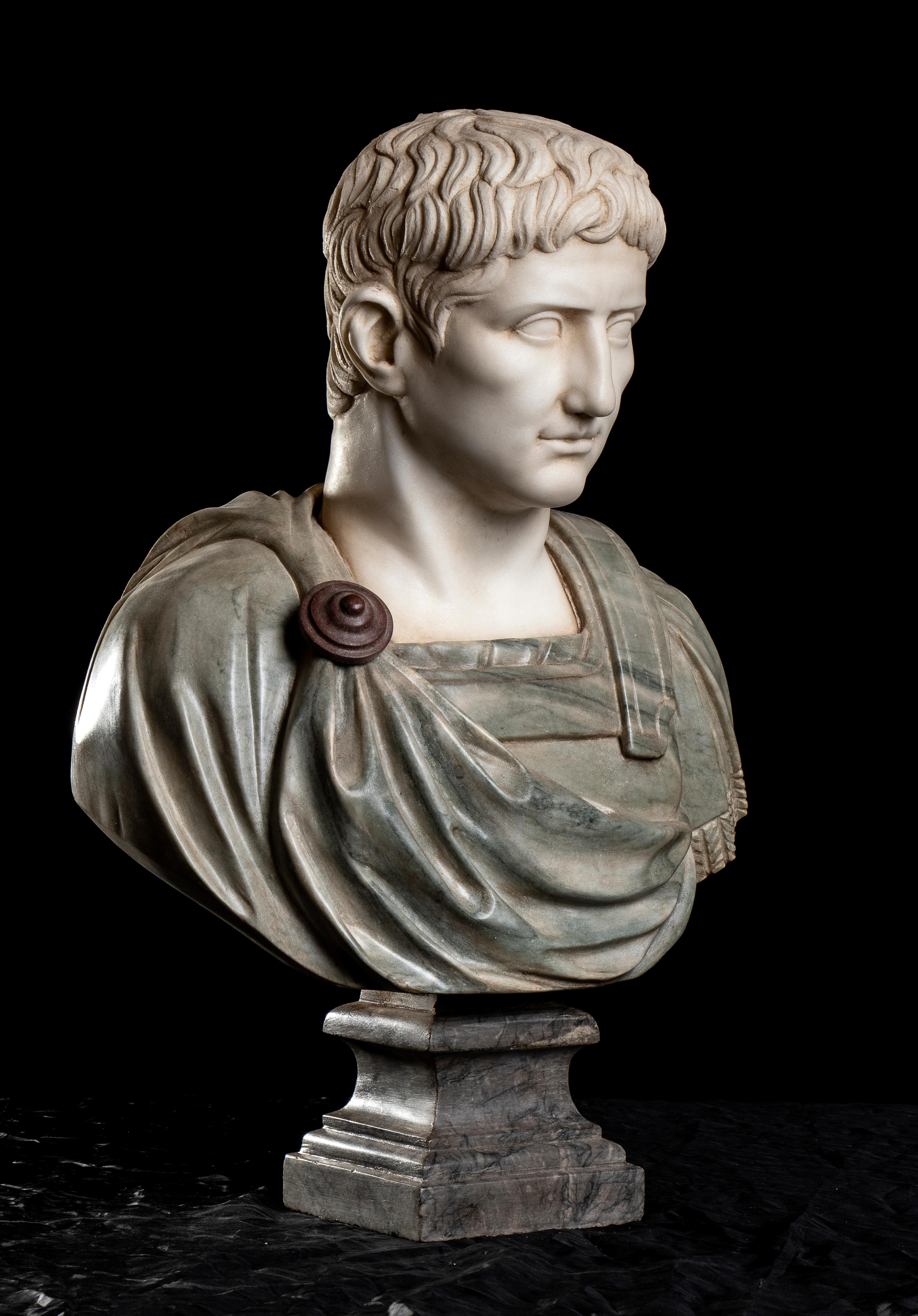 An impressive set of four Italians specimen marble busts of Roman Emperors in the Grand tour Style, carved in polychrome marbles: Cipollino Marble for the armor, Statuary marble for the head, Gray Bardiglio for the base and Rosso Antico for the