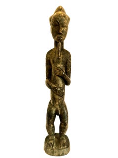 Scultura maschile in legno intagliato africano