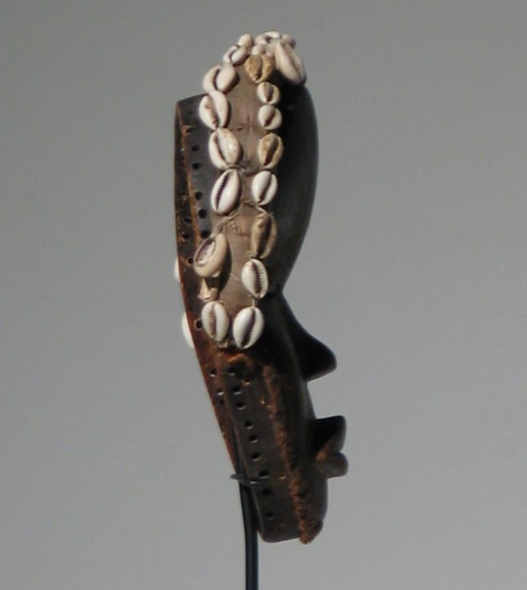 African Dan Mask (Female) - Brown Figurative Sculpture by Unknown