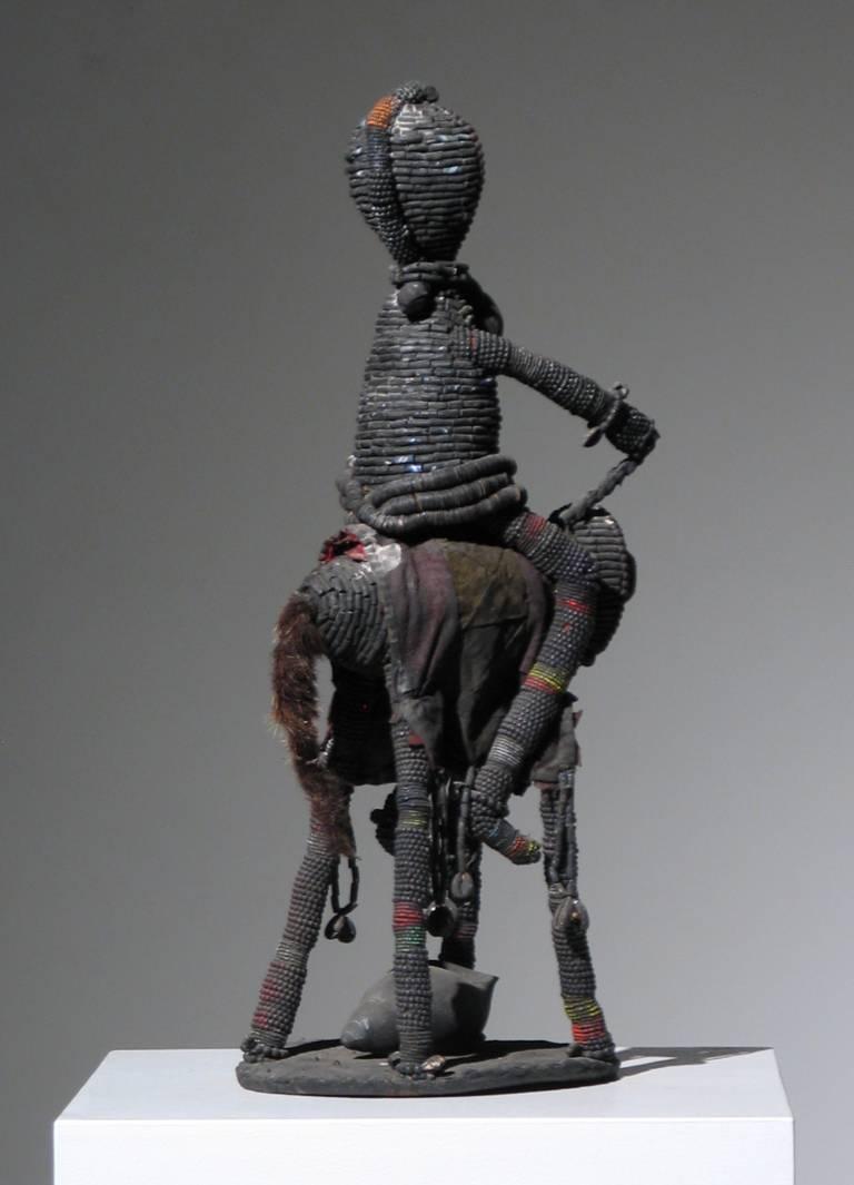 Yoruba Beaded Sculpture
Horse and Rider
Wood, Shells, Textile, Beads and Animal Hair
26 x 9.5 x 12 inches