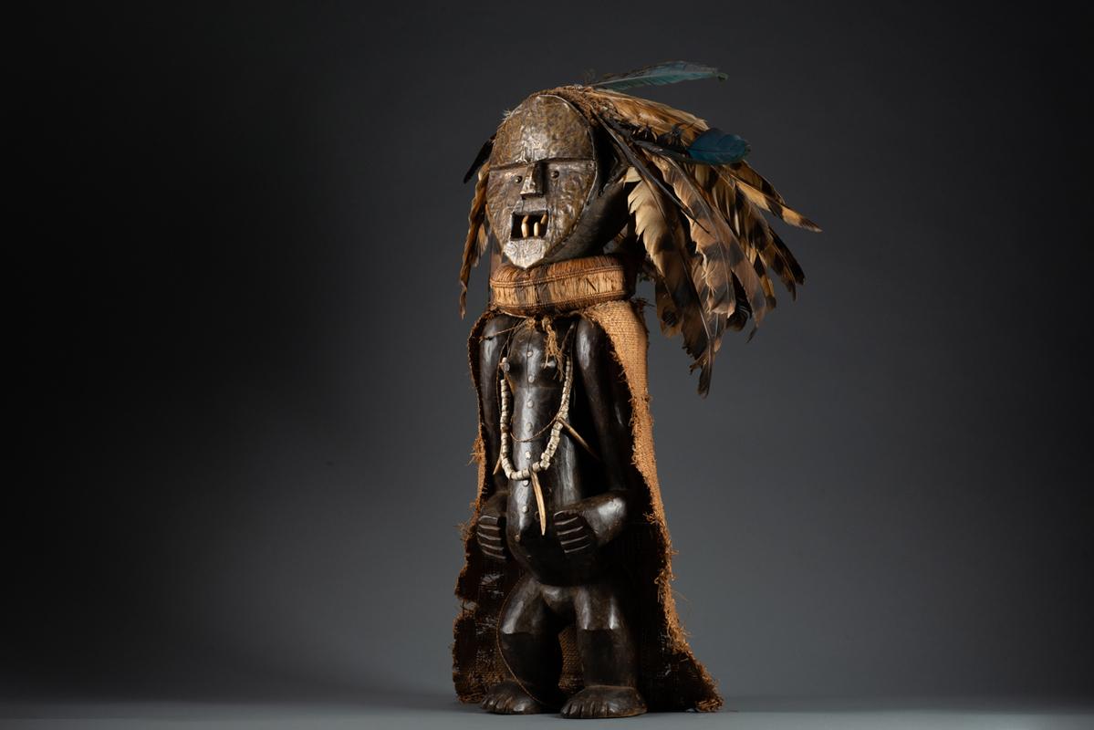 Ambete Reliquary Figure with Feathers - Brown Figurative Sculpture by Unknown
