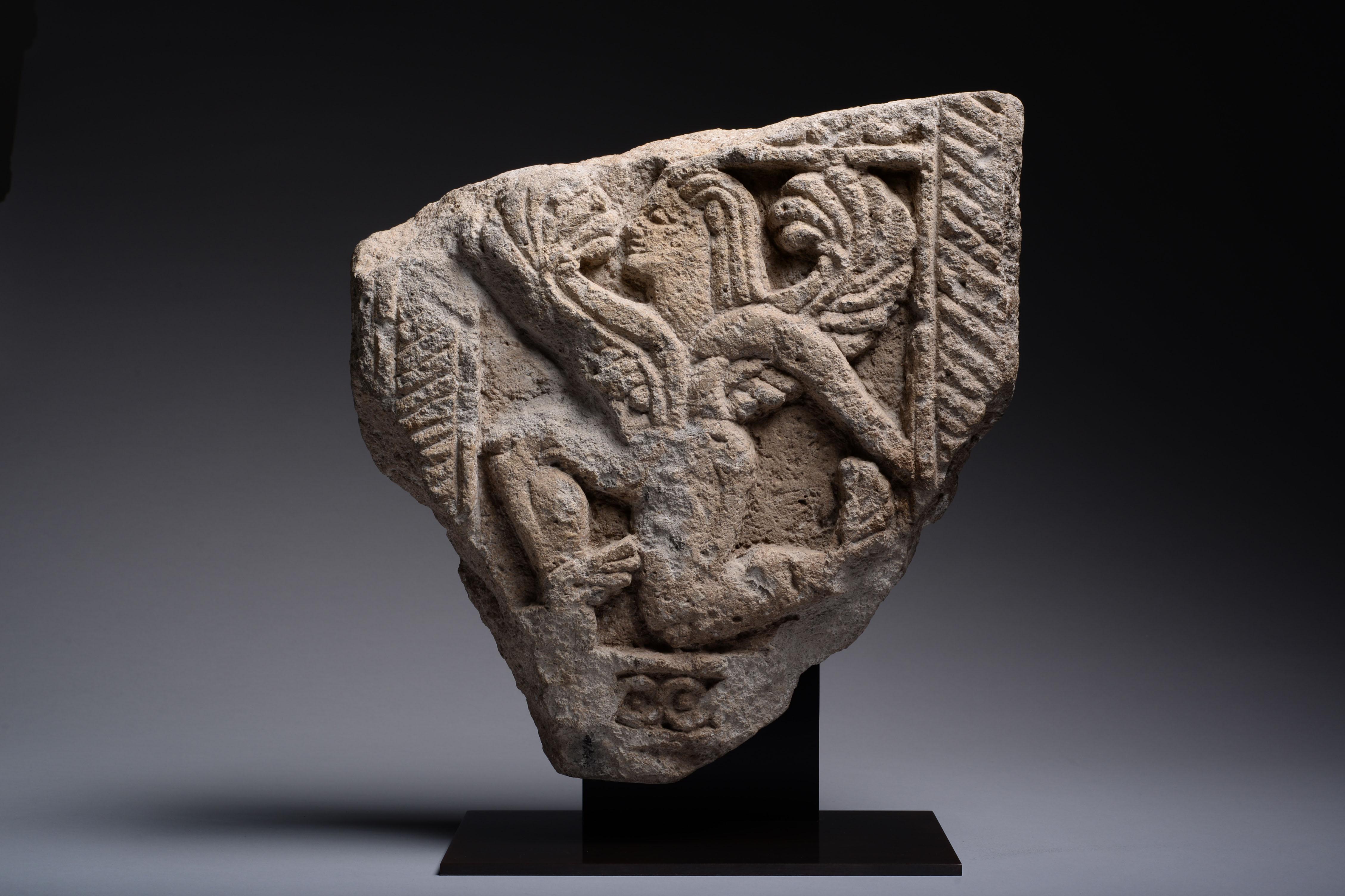 Ancient Etruscan Stone Relief of a Winged God - Sculpture by Unknown