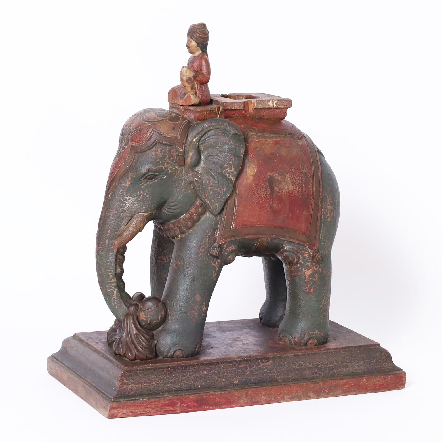 Intriguing 19th century Anglo Indian elephant and rider with a serene ambiance, having a polychrome finish now aged to perfection. Presented on a classic beveled plinth.