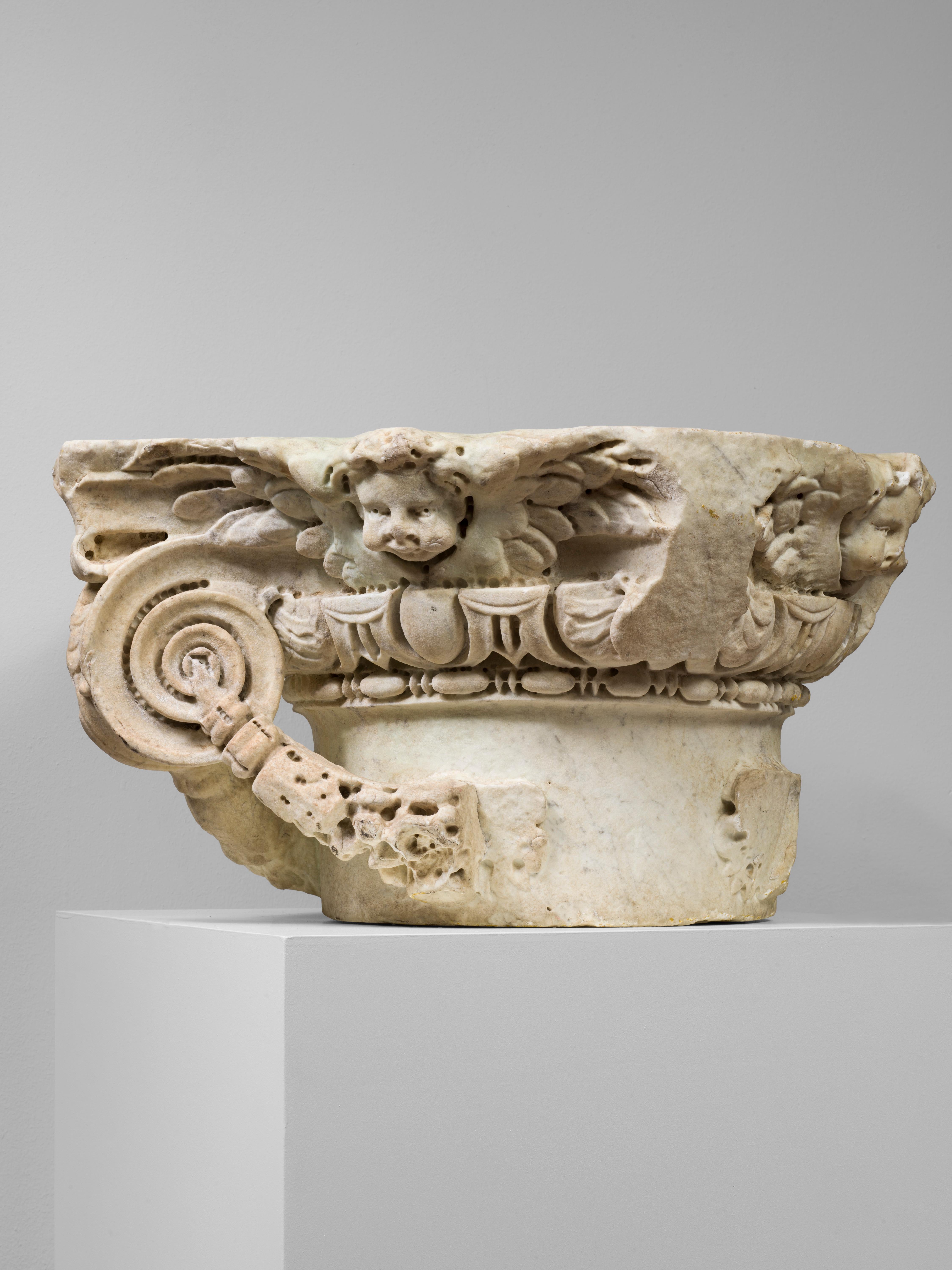 Unknown Figurative Sculpture - ANTIQUE ITALIAN RENAISSANCE IONIC MARBLE CAPITAL WITH PUTTI, 16TH CENTURY