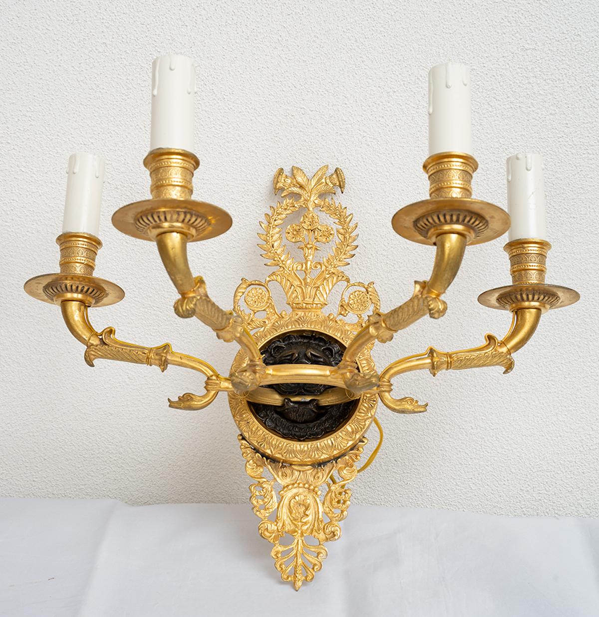 Antique French Empire gilt bronze and patinated bronze wall sconce. 19th Century - Gold Figurative Sculpture by Unknown