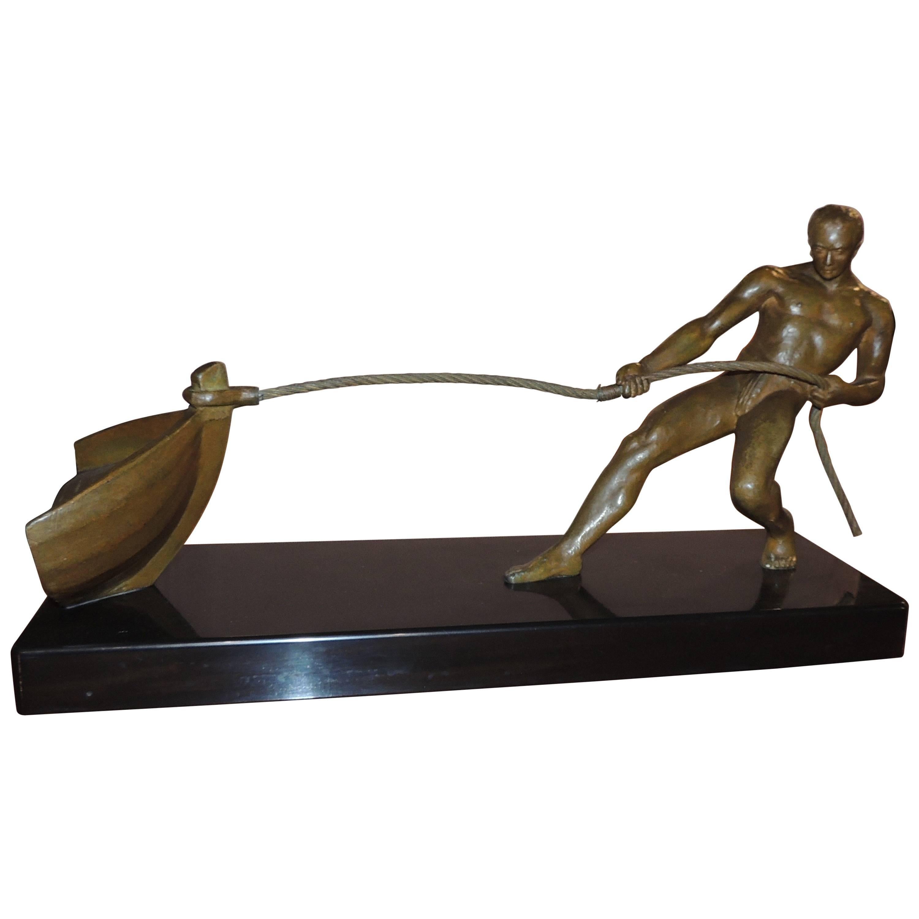 Unknown Figurative Sculpture - Art Deco Bronze Statue of Man Pulling Boat Sculpture