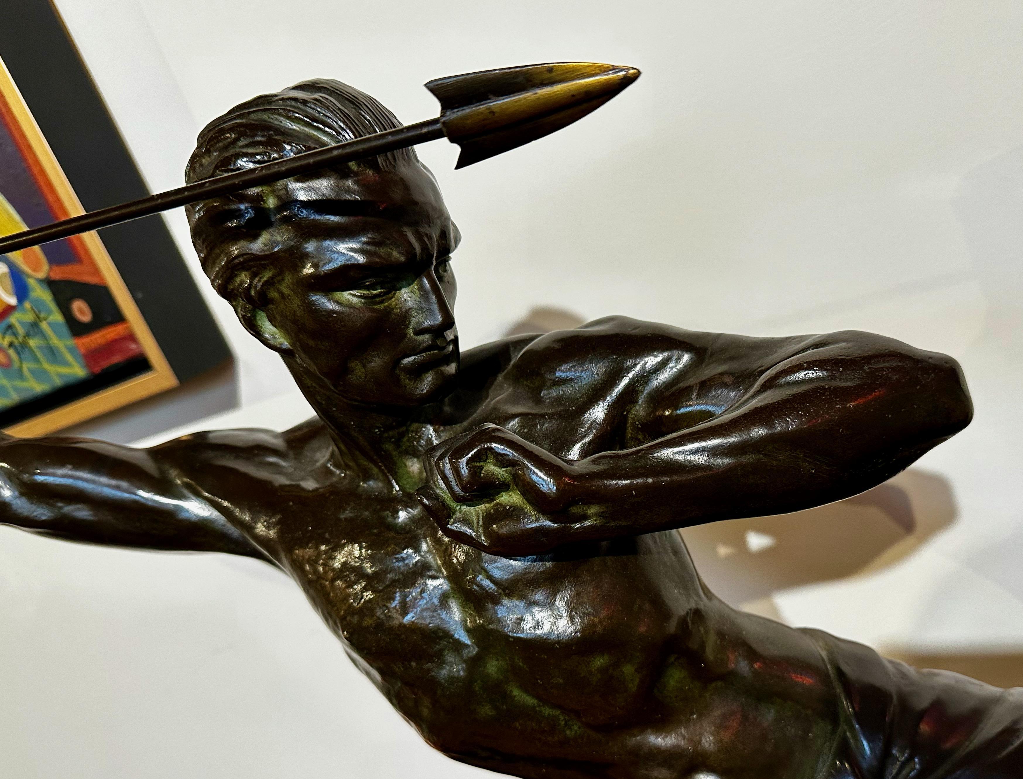 Large original bronze by P. Hugonnet signed on the marble, it is depicting the classic javelin thrower. This is a very well-detailed and quite intense figure. Look at his face, his hands, his muscular formation. Many of these classic athletic poses
