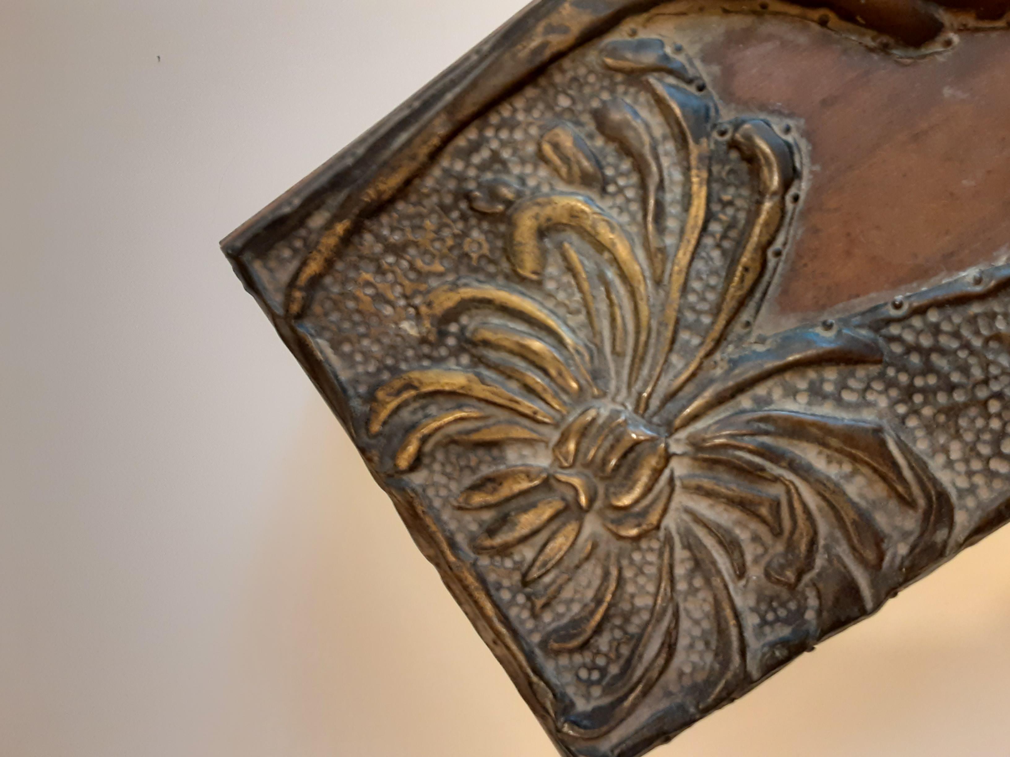 This elegant Art Nouveau box was originally made in France circa. 1910, and remains in very good condition. It was acquired from a French estate. The lid of the box is decorated with beautifully intricate metal (possibly bronze) scrollwork flowers