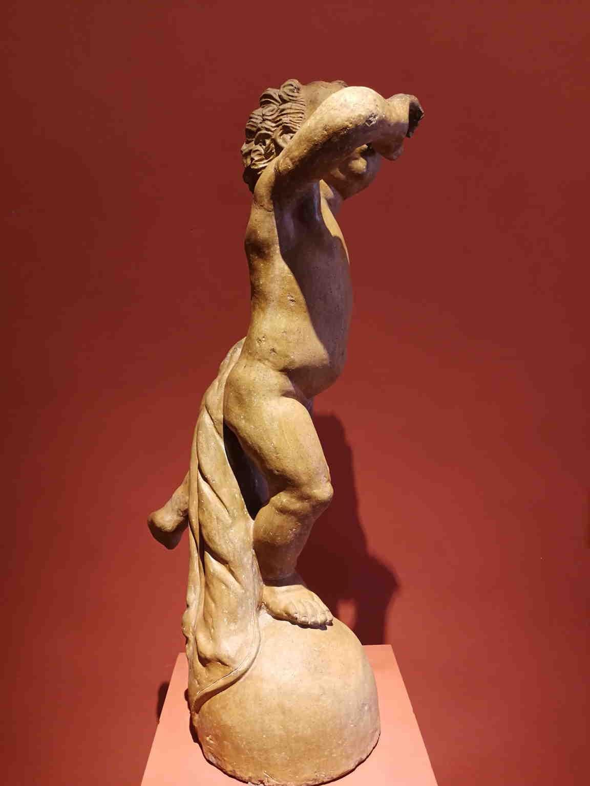 Artista fiorentino del XVII secolo da Verrocchio putto fontana in terracotta - Brown Figurative Sculpture by Unknown