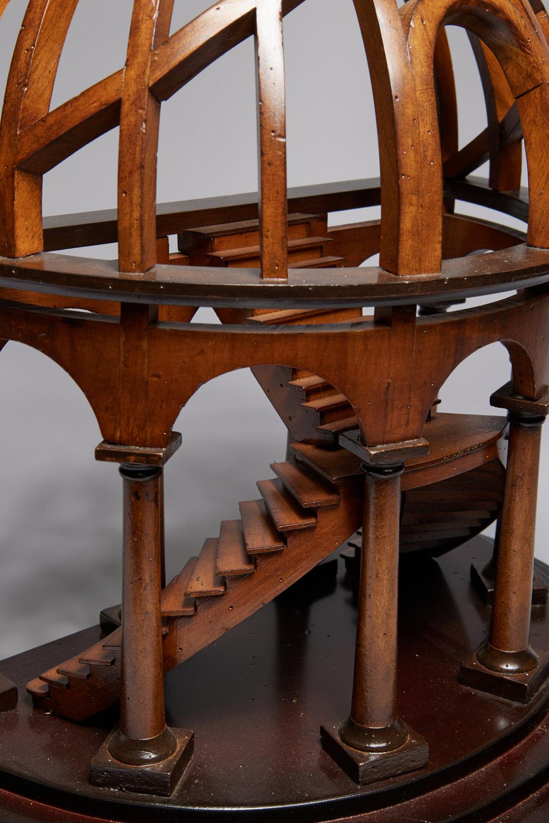 Authentic Models
Demi Dome Architectural Model Wooden Staircase, 20th Century
Wood 
Stamped 'AM' on bottom
16 x 18 x 10 inches

Double staircase surrounded by a reticulated domed top supported by wooden columns on a stepped, semi-circular base. 