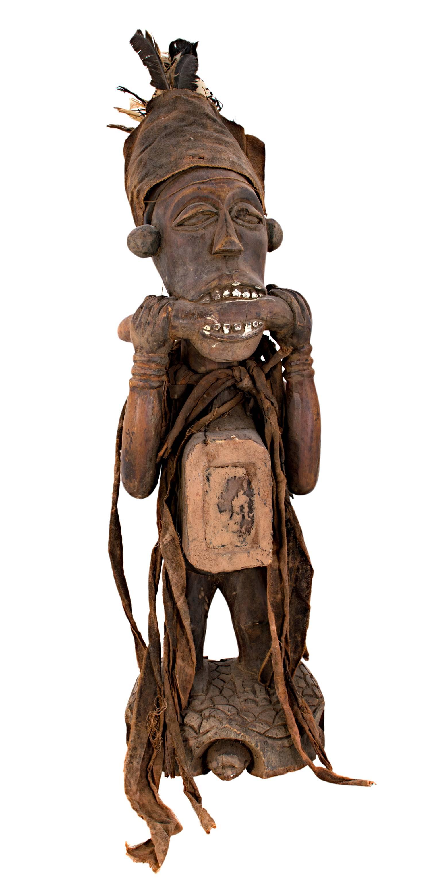 Unknown Figurative Sculpture - "Bacongo Statue, Used as Fetish - Zaire, " Wood, Glass Feathers, & Cloth 