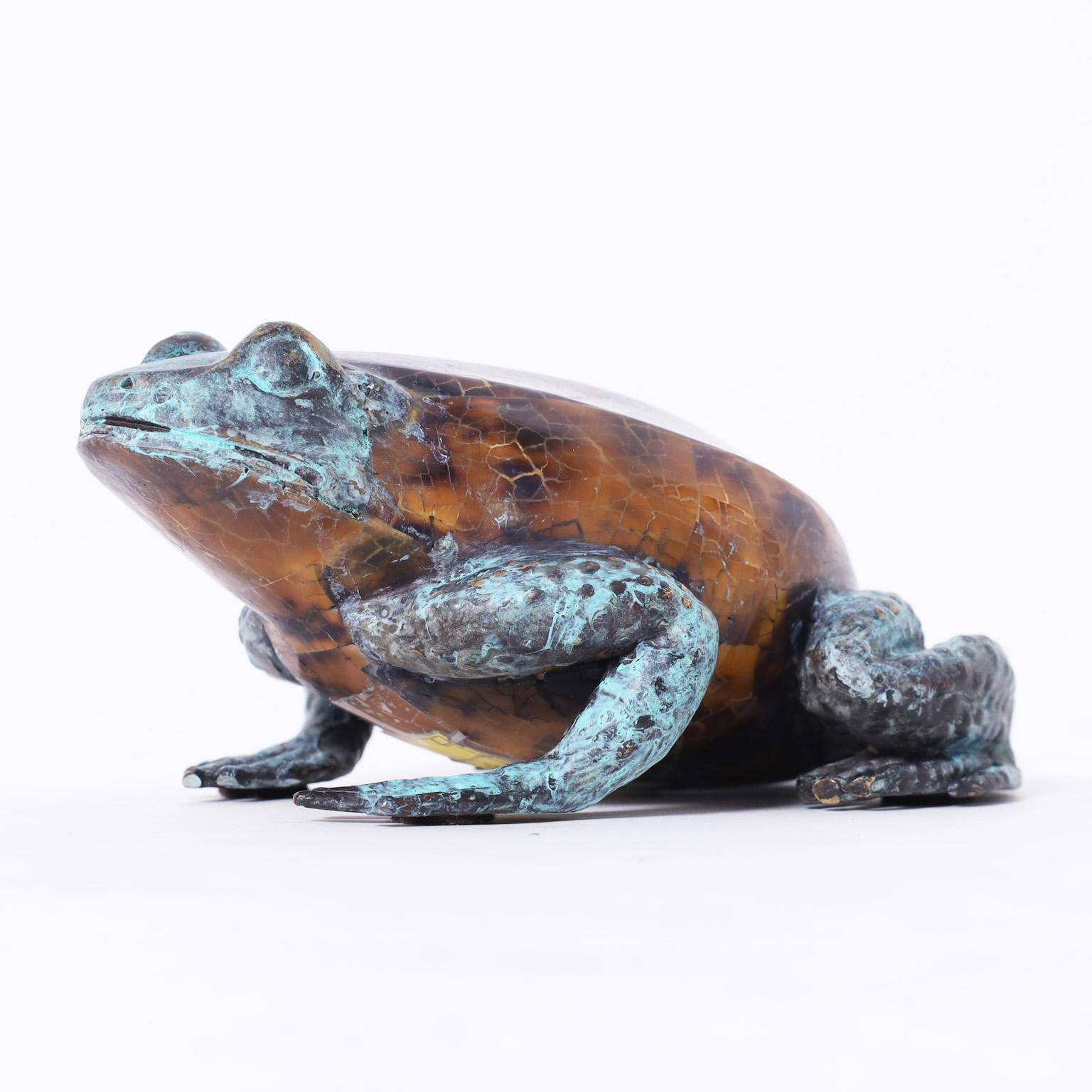 Mid century life size frog crafted in cast bronze with a lush verdigris finish and featuring a tortoise shell body. Signed Maitland-Smith on the bottom.