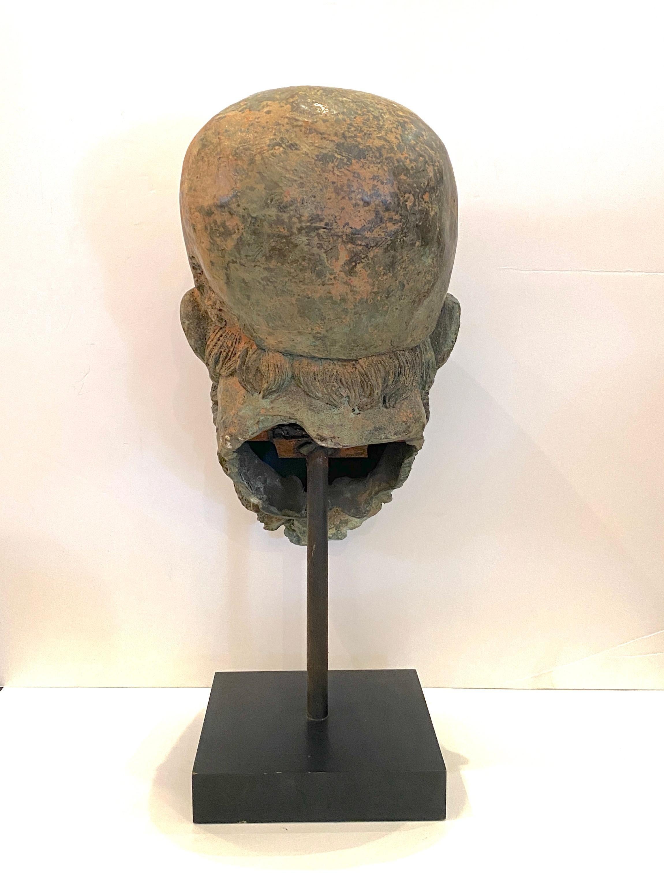 A mounted, cast bronze head of soldier in the Grand Tour style.