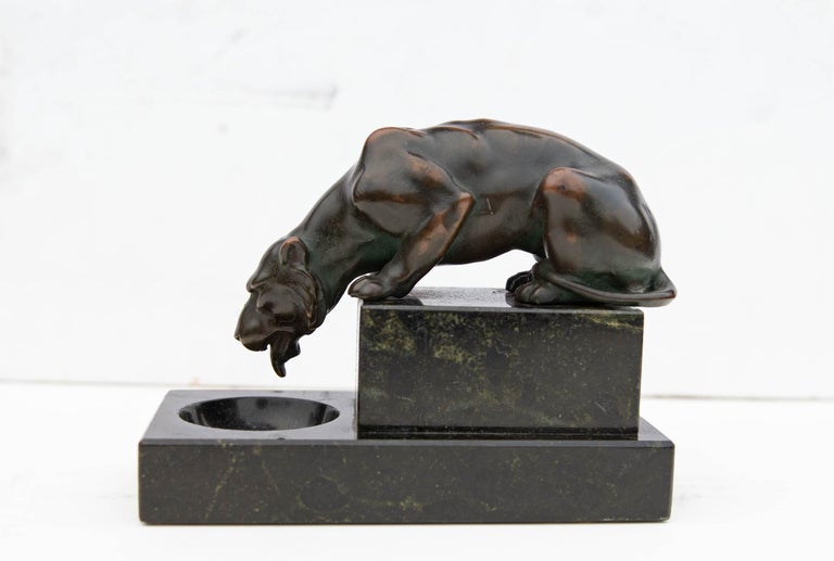 Antique decorative desk ornament. Bronze sculpture of a lioness mounted on green marble base, circa 1900.