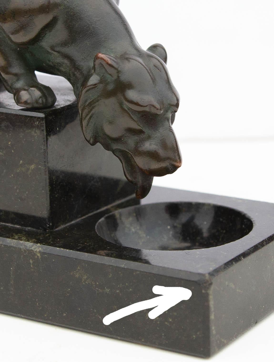 Antique decorative desk ornament. Bronze sculpture of a lioness mounted on green marble base, circa 1900.