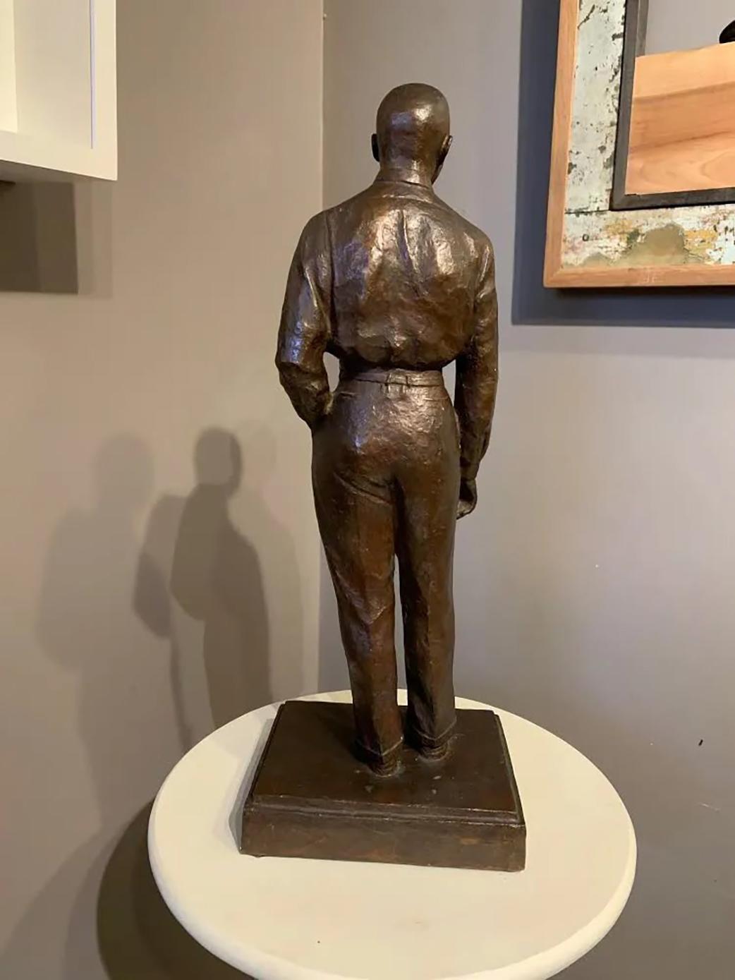A Mid 20th century American School cast patinated bronze sculpture of a gentleman or businessman, probably circa 1930-1950, unsigned, with a question mark on the front of the base. Very good condition, with great patina and minimal imperfections.