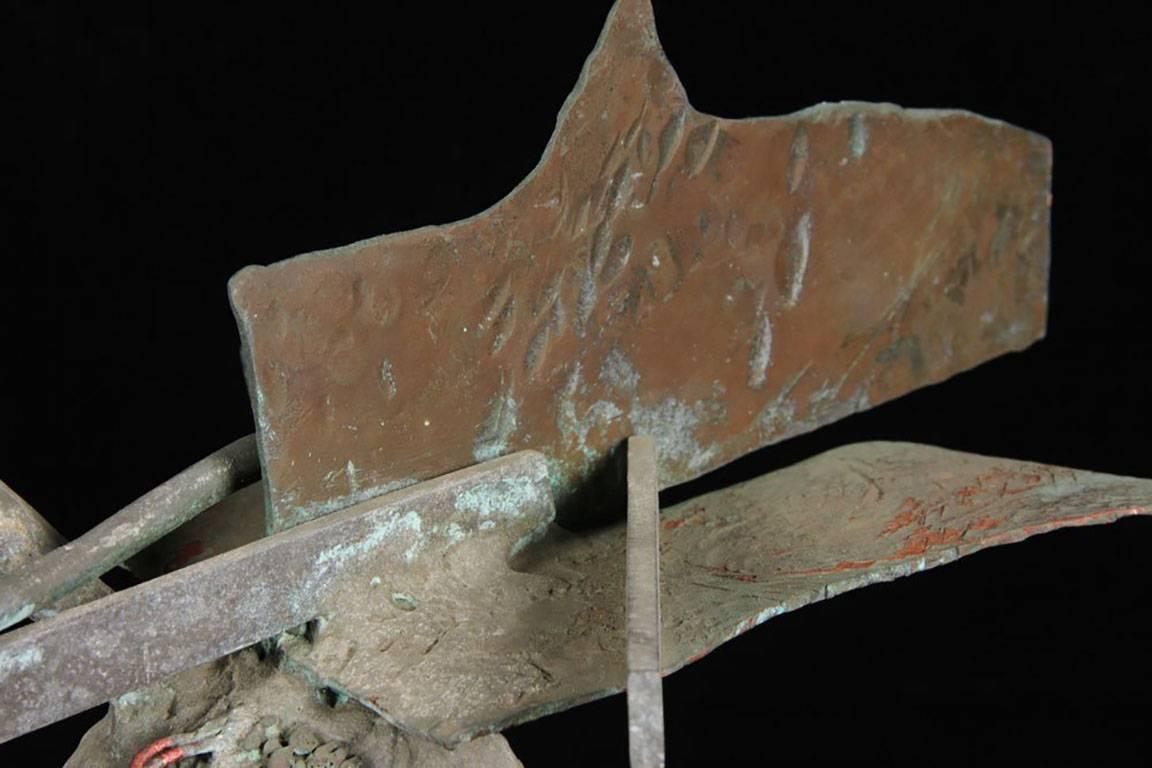 In the manner of Julio Gonzalez, mixed metal sculpture. 
Neo-Dada Abstract Sculpture: Assemblages

Abstract sculpture followed a slightly different course. Rather than focusing on non-figurative subject matter, it concentrated on materials, hence